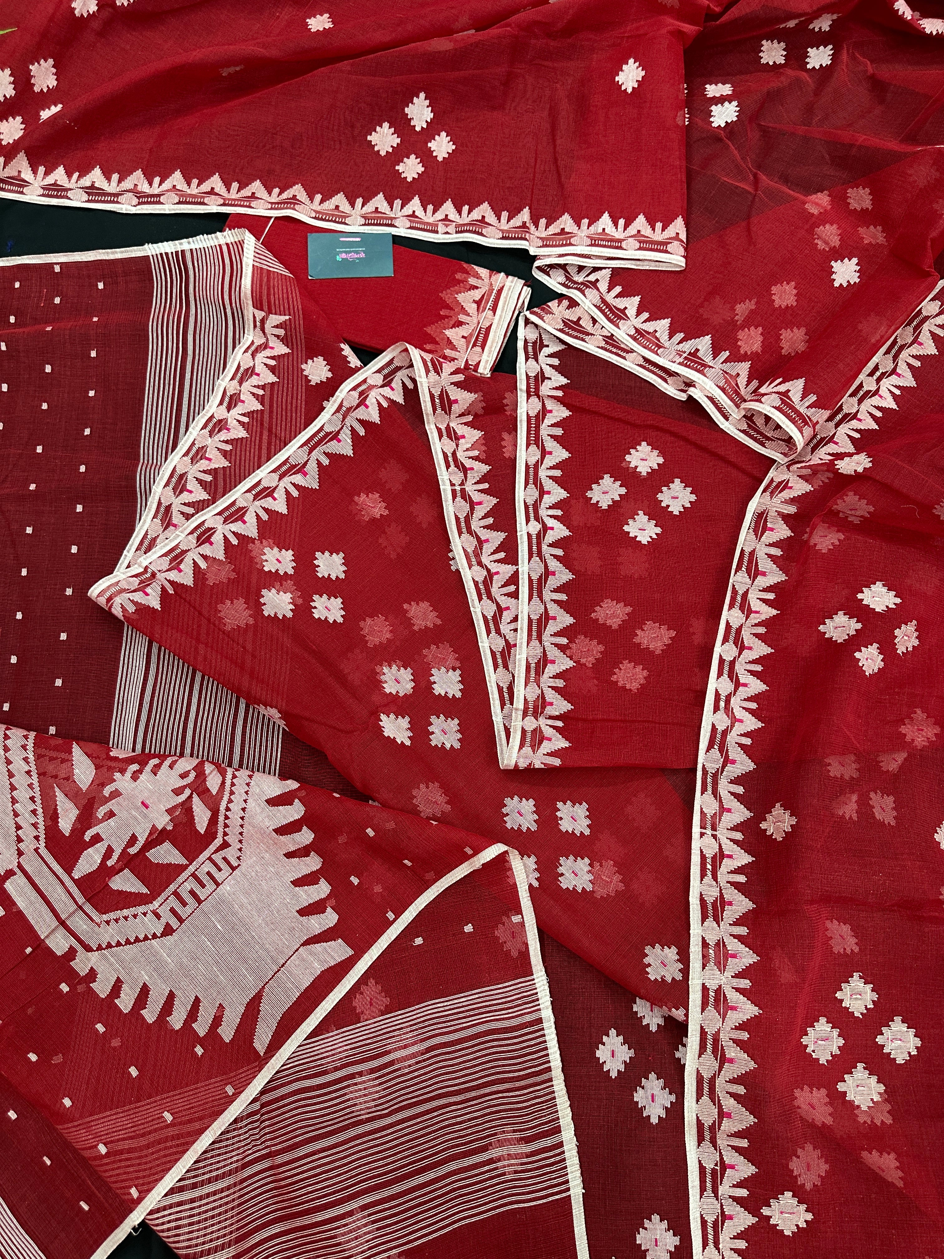 Radish Maroon cotton jamdani saree with white threads work all over work.