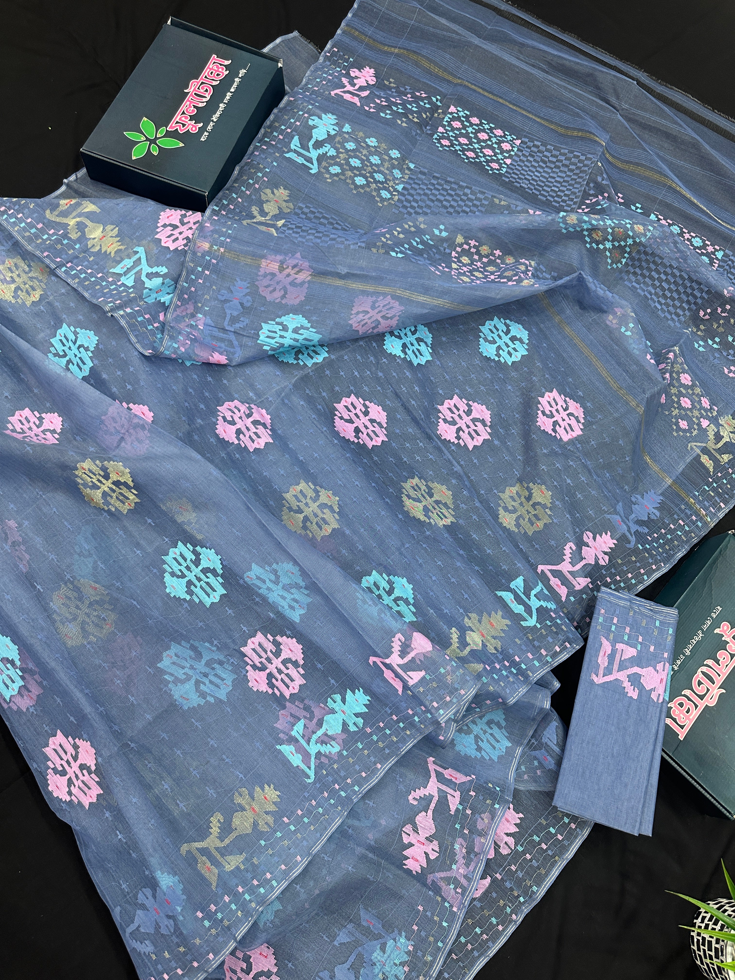 Powdery blue jamdani saree with pink blue and golden jori work.