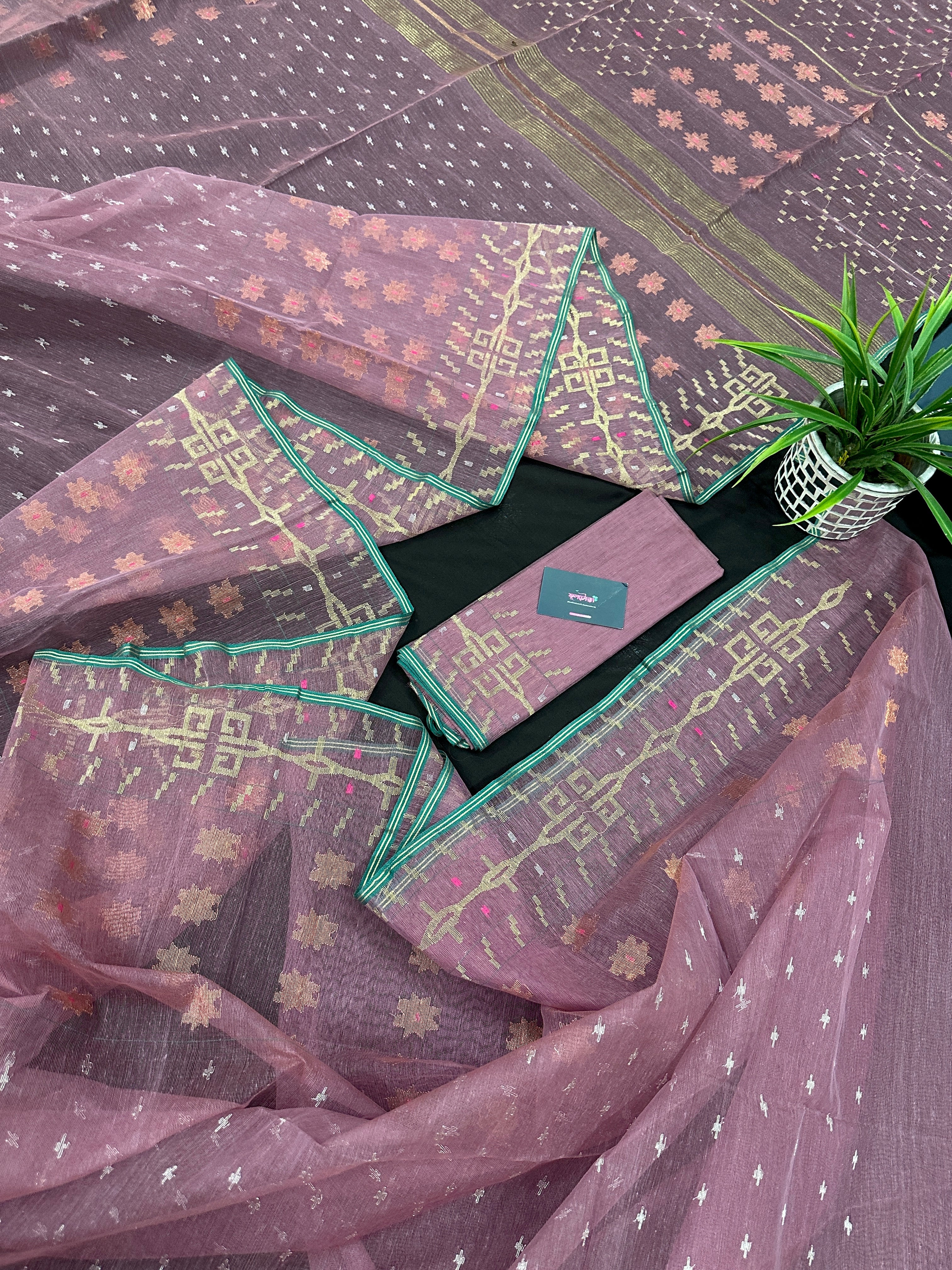 Onion colour jamdani saree with pink meena and green border.