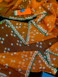 Orange soft jamdani saree with silver jori work & green border.