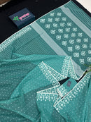 Mint cotton jamdani saree with white threads work all over work and blouse piece.