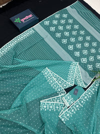 Mint cotton jamdani saree with white threads work all over work and blouse piece.