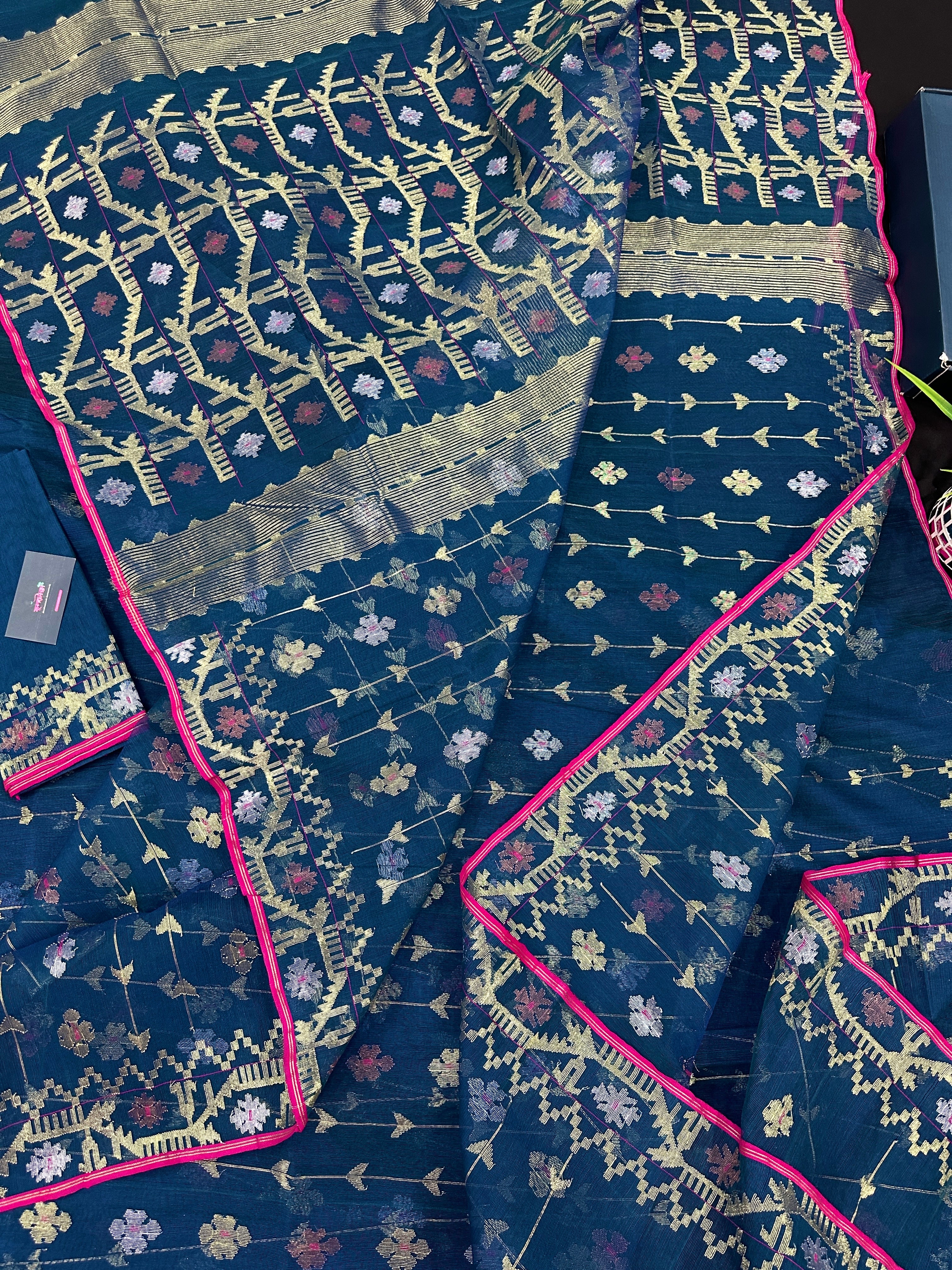 Peacock blue jamdani saree with golden silver copper jori work and pink border