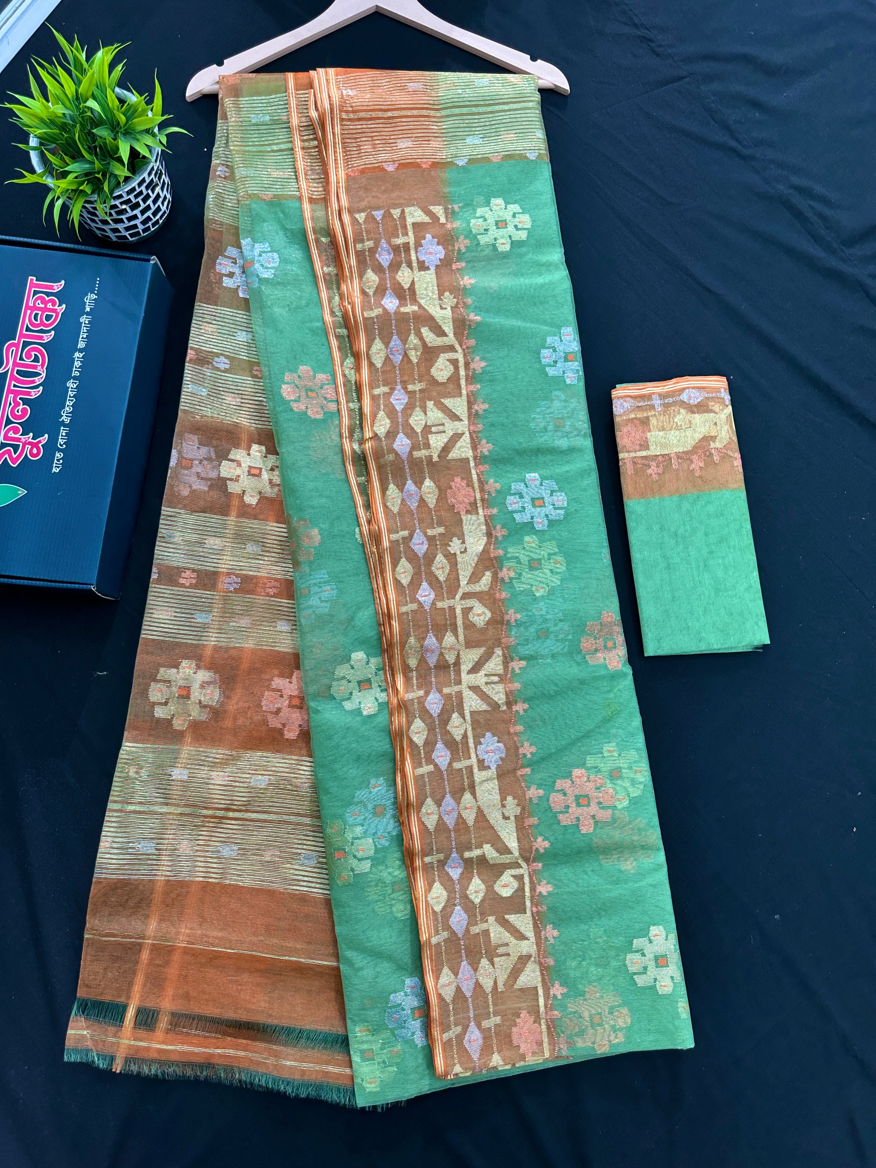 Pastel green halfsilk jamdani saree with golden brown contrast and golden silver copper jori work