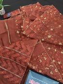 Mehendi brown jamdani saree with golden work.