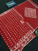 Maroon jamdani saree with white thread work.