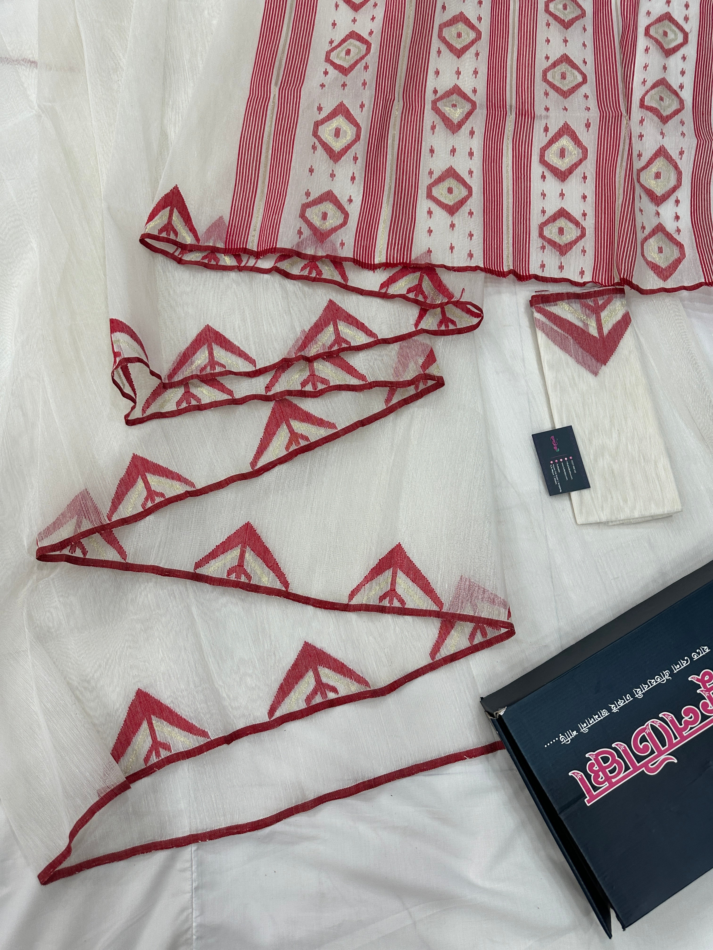 White Jamdani Saree With Red Paar.