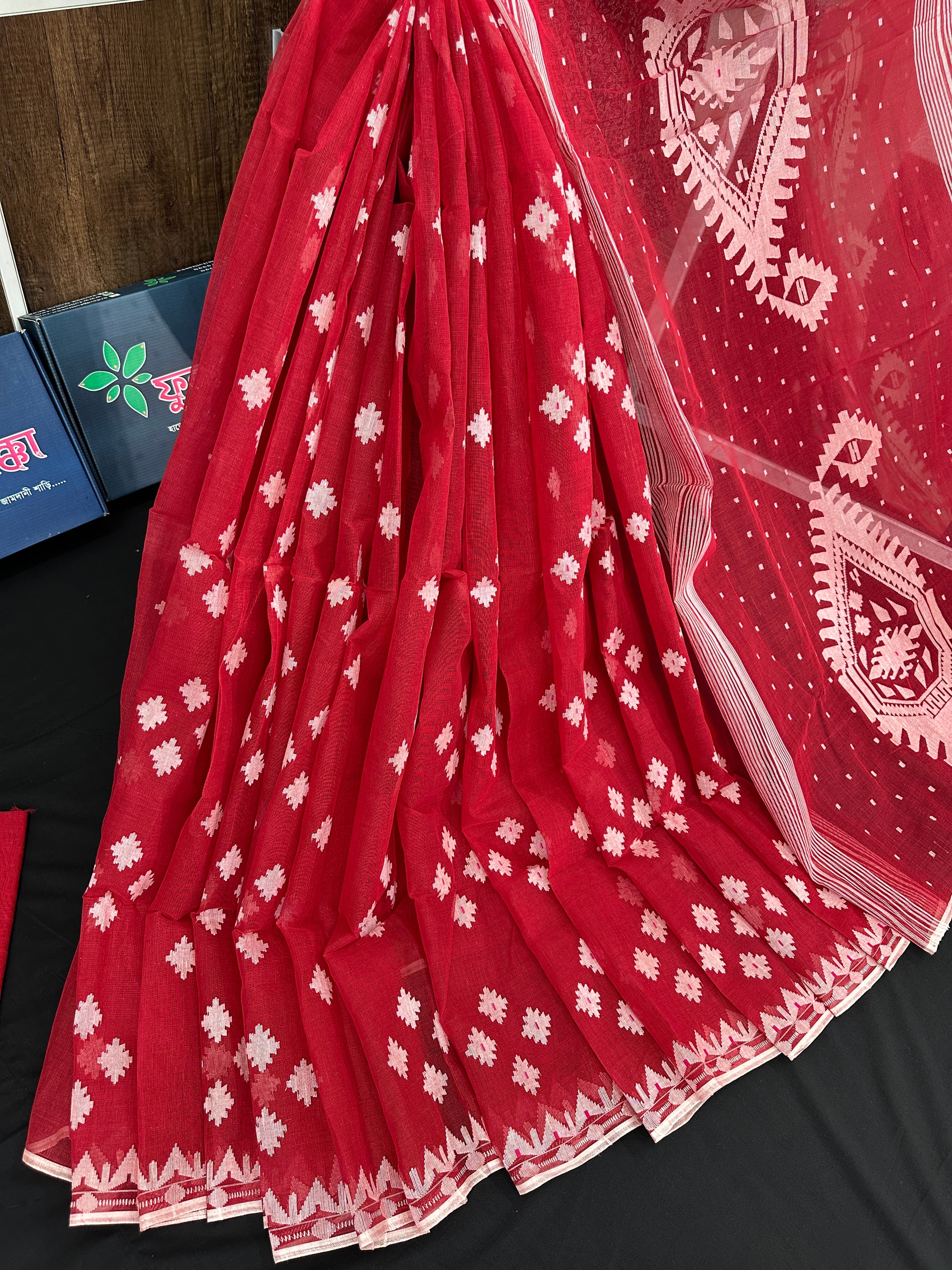 Radish Maroon cotton jamdani saree with white threads work all over work.