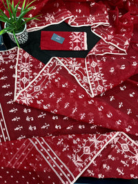 Maroon jamdani saree with white thread work.