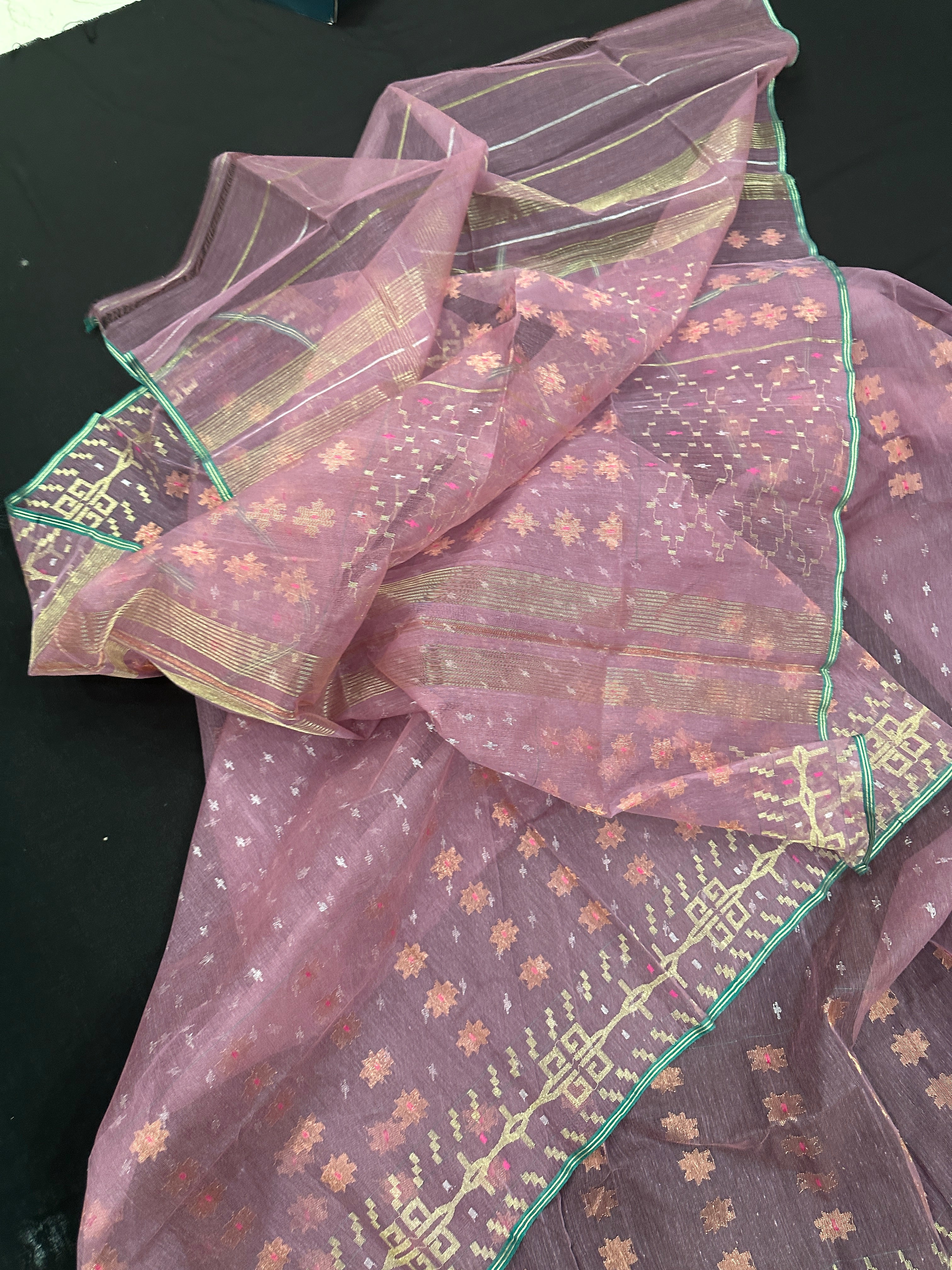 Onion colour jamdani saree with pink meena and green border.