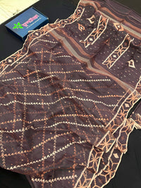 Brown colour jamdani saree with brown & off white threads work.