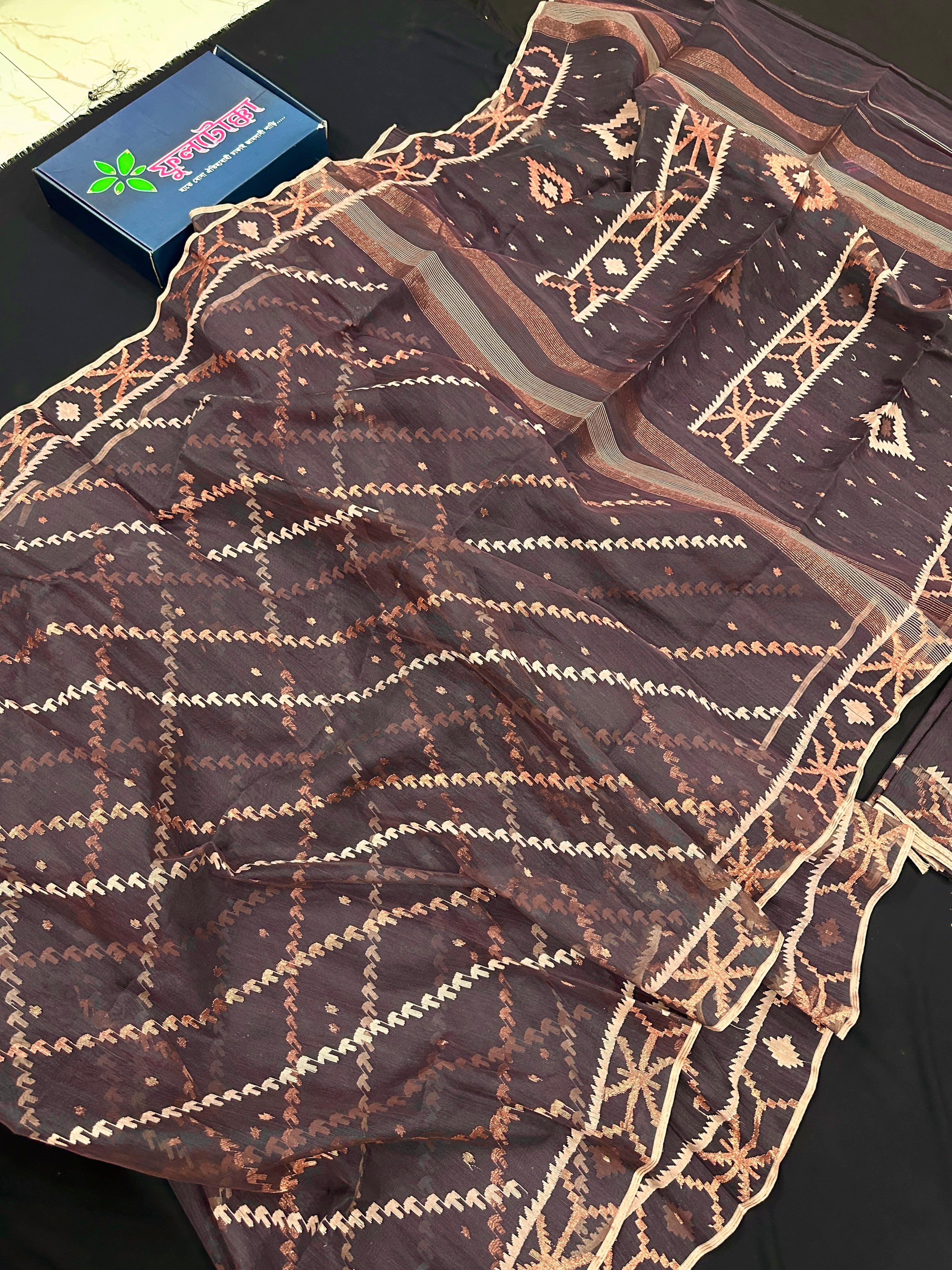 Brown colour jamdani saree with brown & off white threads work.