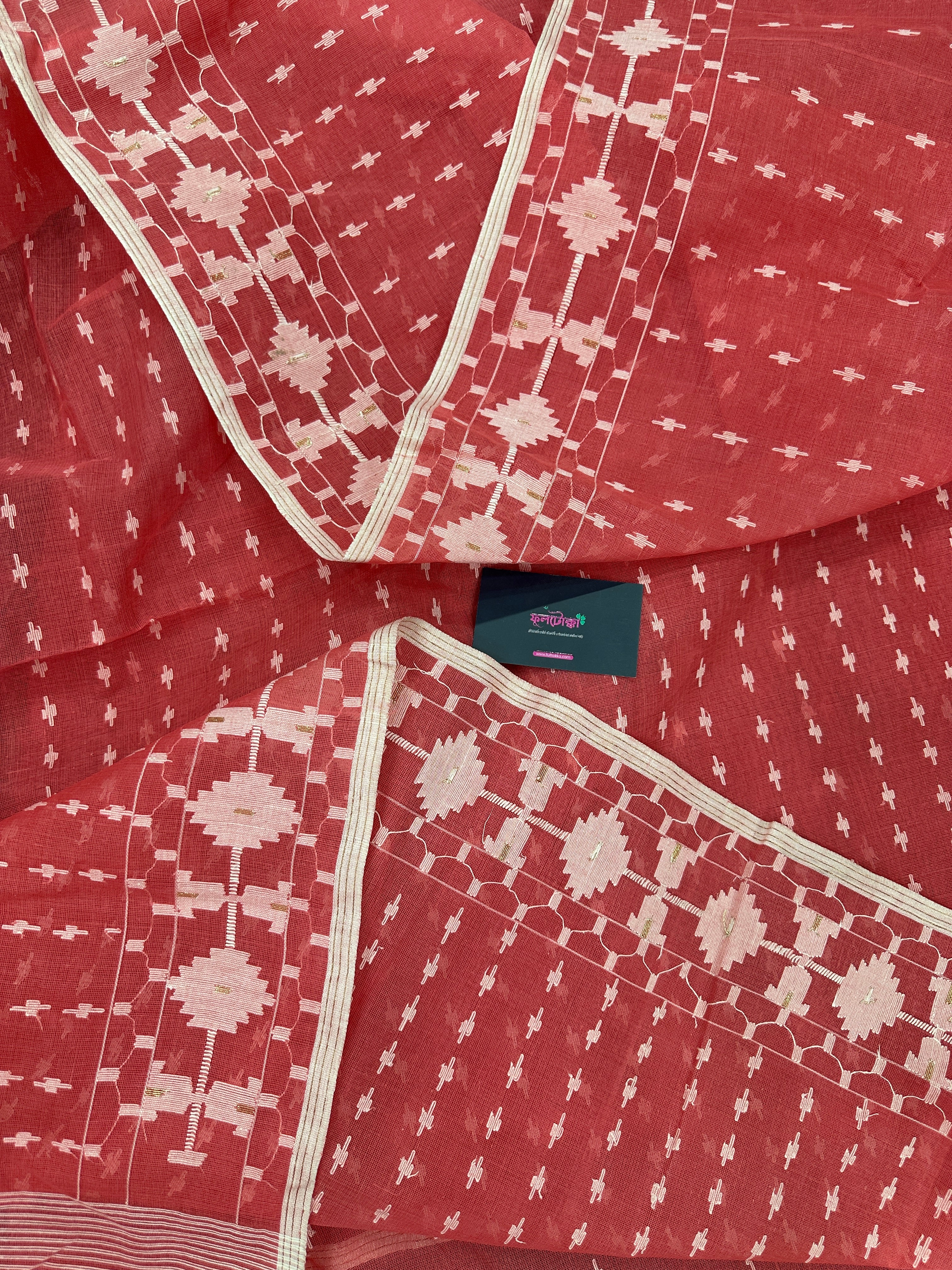 Sweet pink cotton jamdani saree with white threads work and blouse piece.