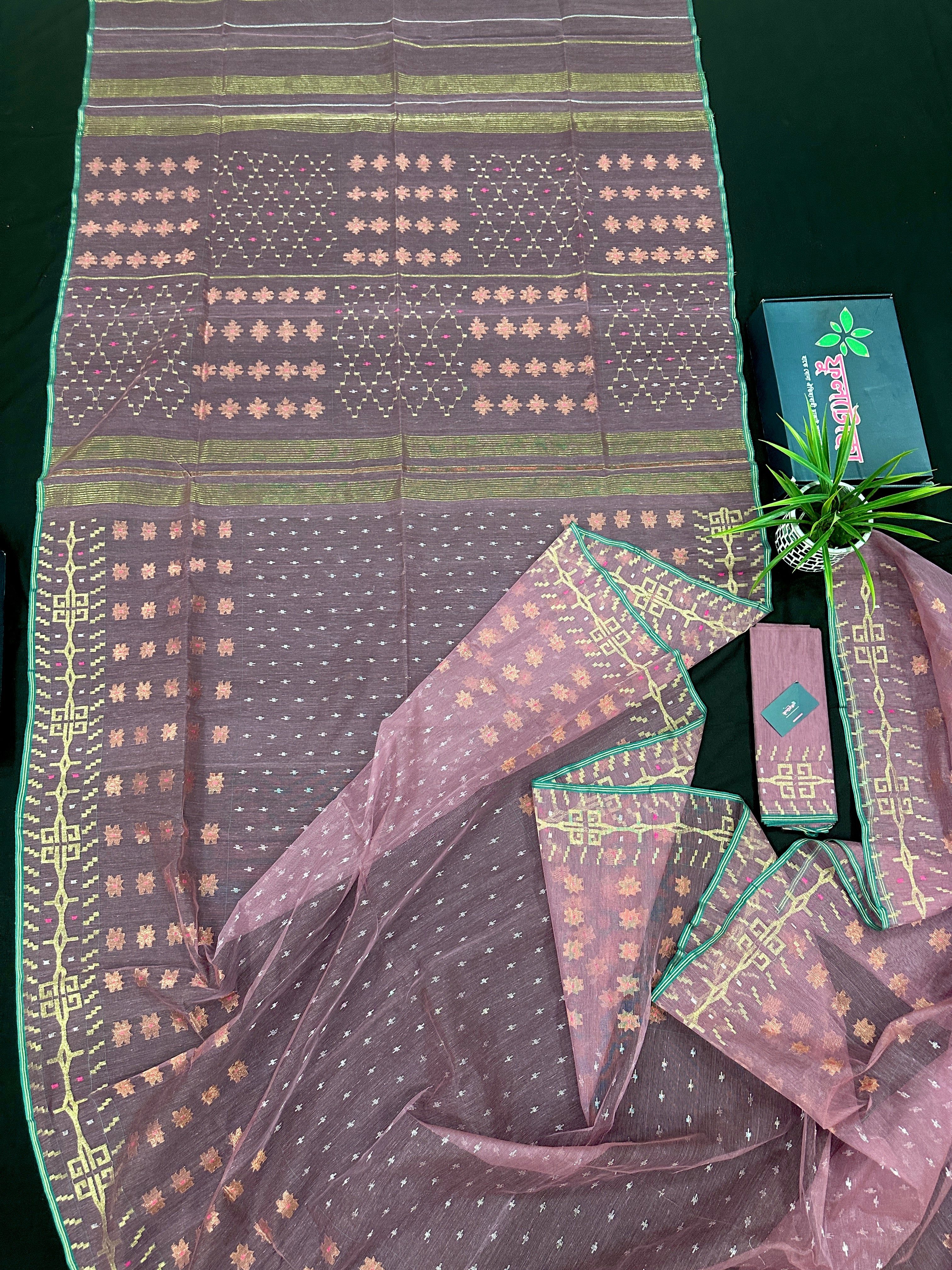 Onion colour jamdani saree with pink meena and green border.