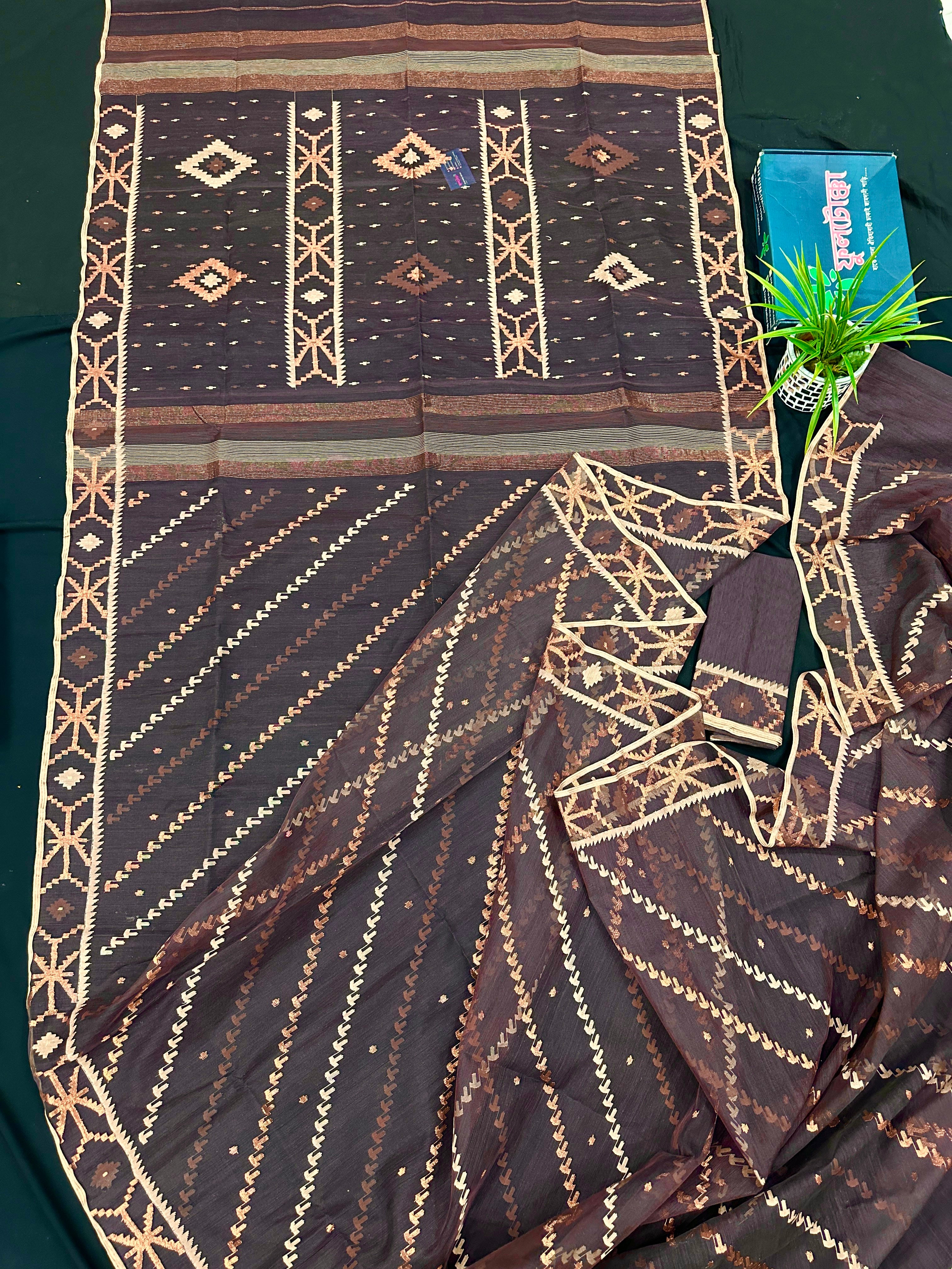 Brown colour jamdani saree with brown & off white threads work.