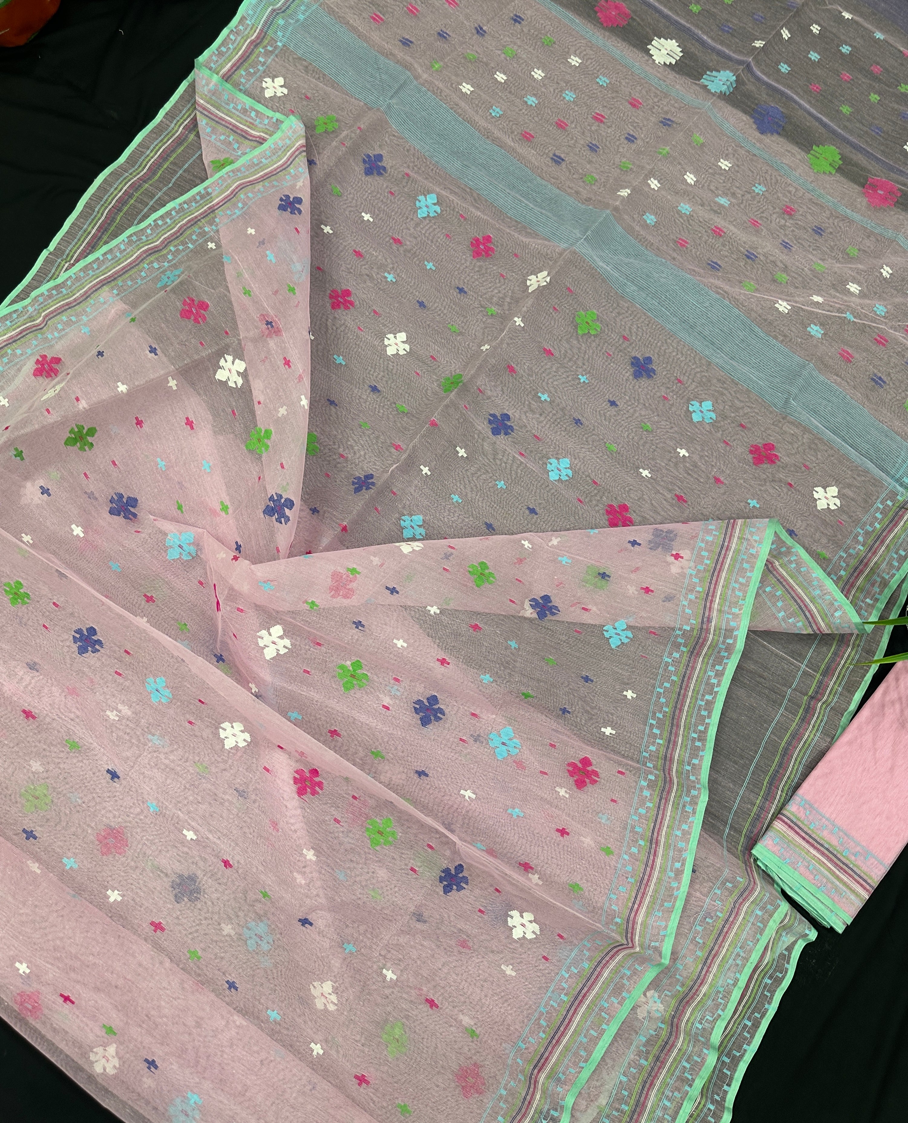 Baby pink jamdani saree with blue pink green threats work and blouse piece.