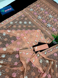 Creamy peach jamdani saree with pink white and peach threads work.