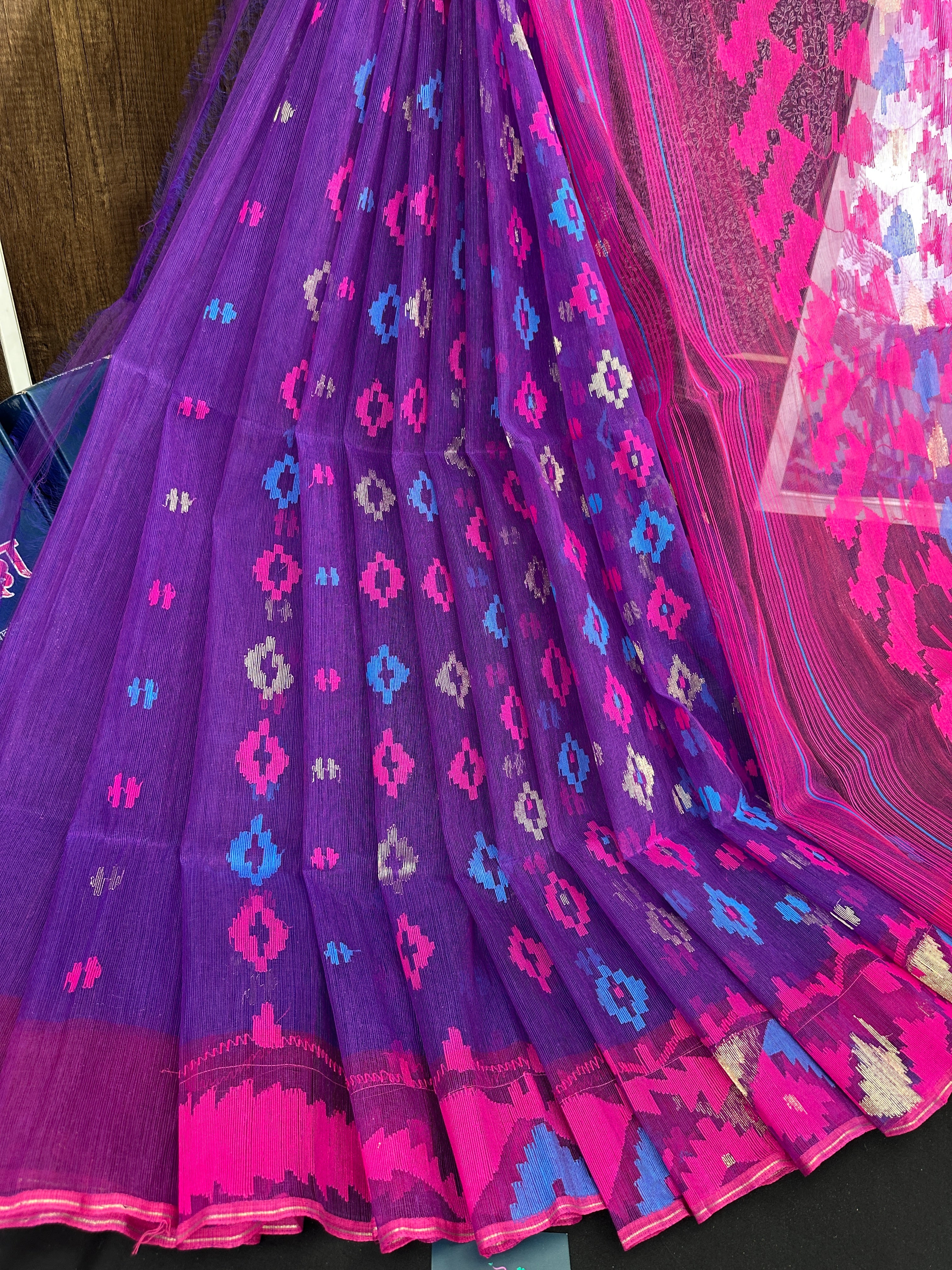 Purple halfsilk jamdani saree with blue pink threads work and golden jori work