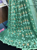Jade green halfsilk jamdani saree with green off white golden self threads work