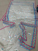 White jamdani with pink border.