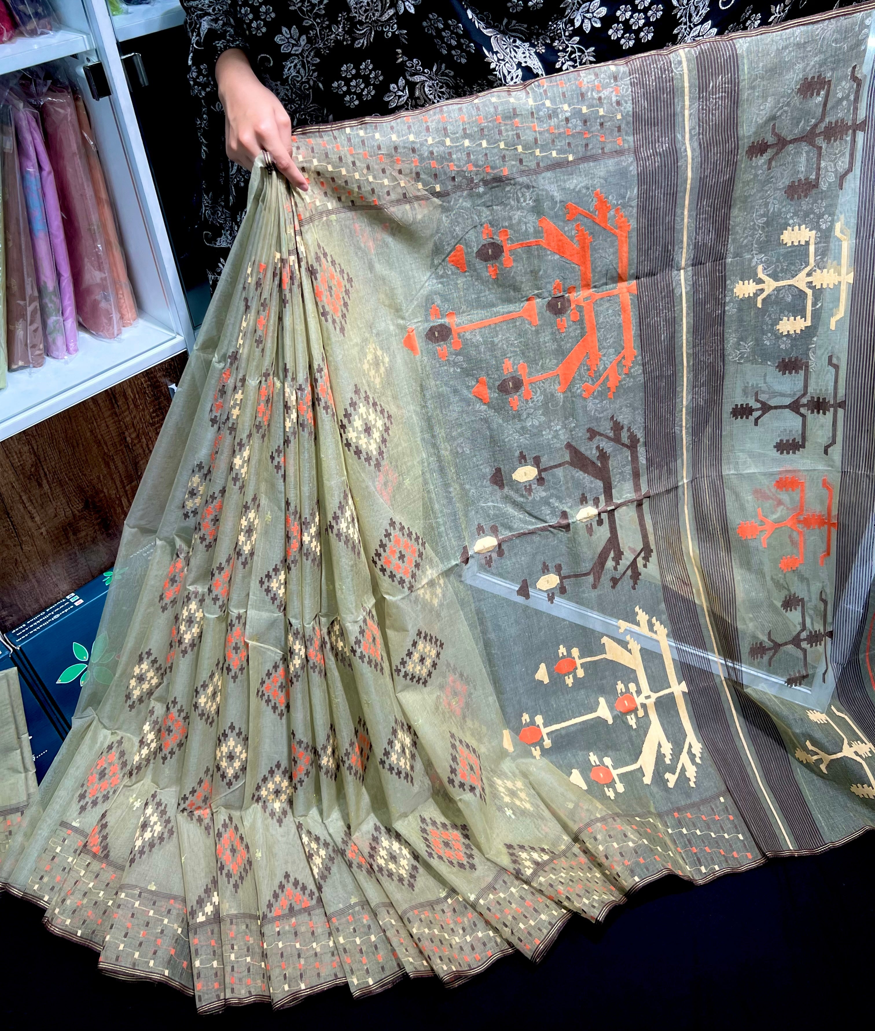 Dark olive halfsilk jamdani saree with orange off white coffe threads work