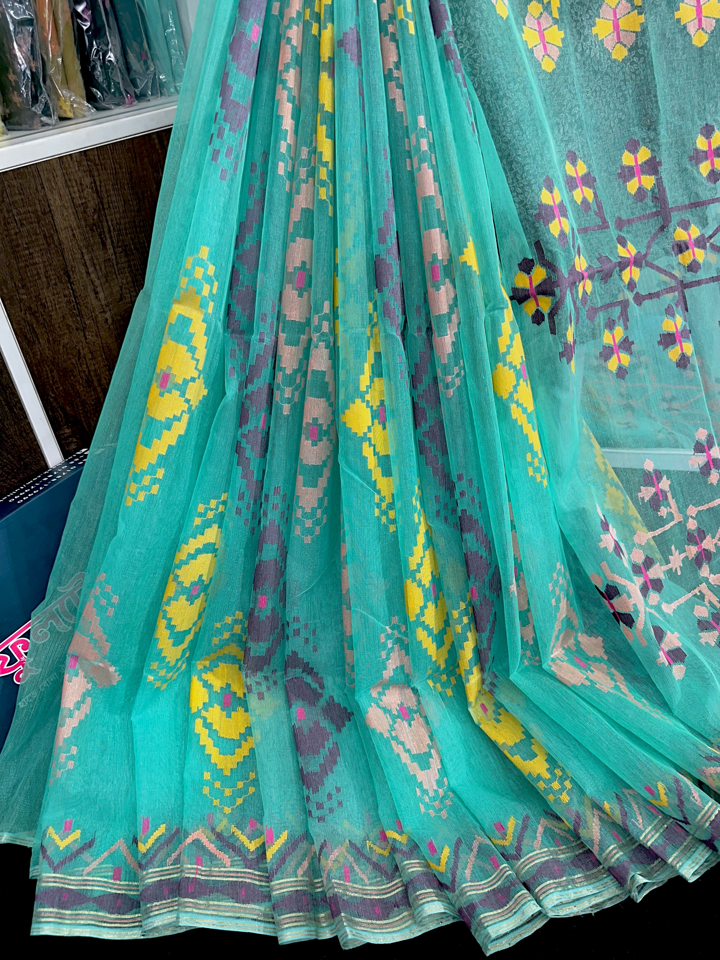 Turquoise blue exclusive halfsilk jamdani saree with yellow pink purple golden threads work