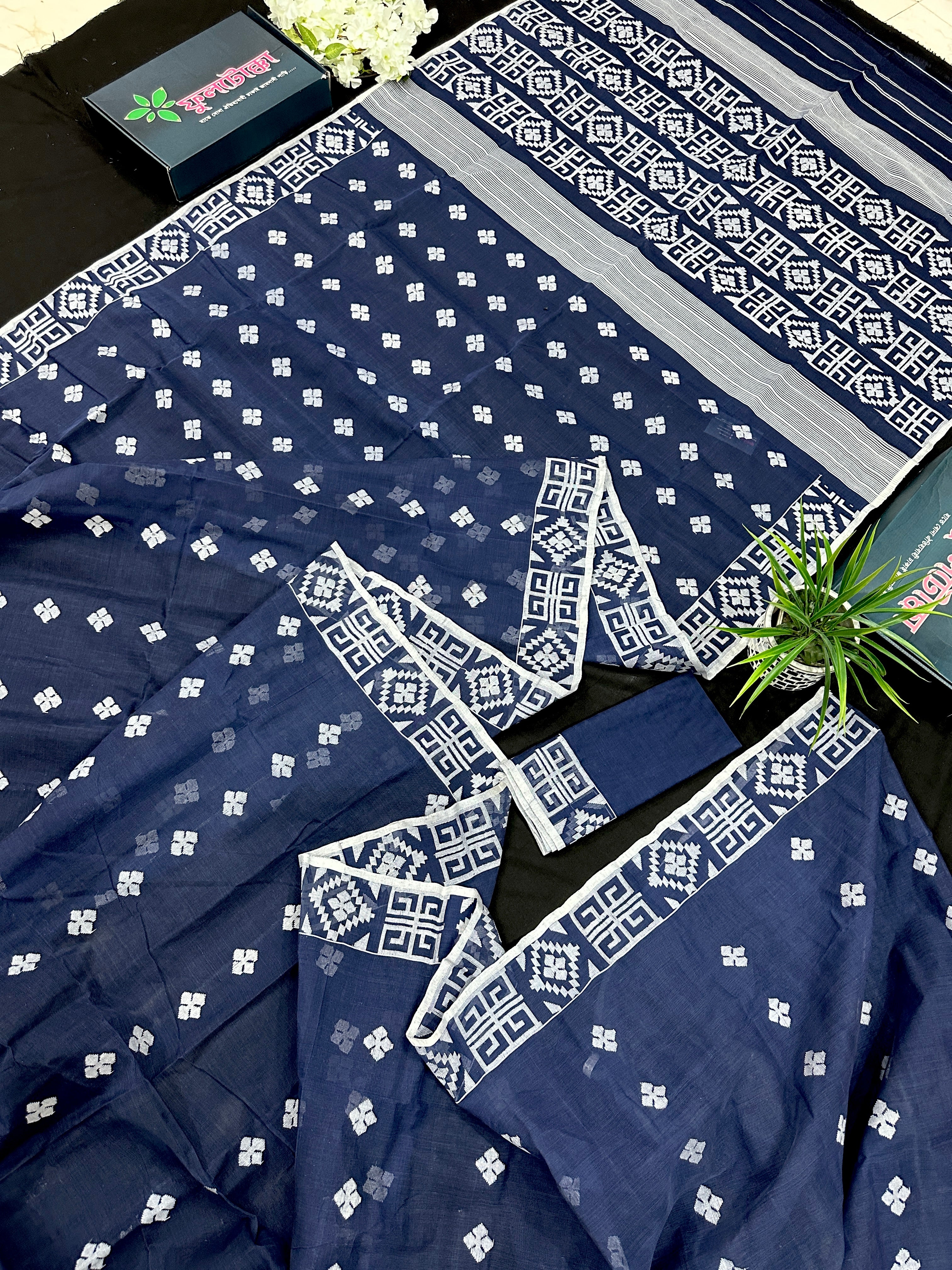 Deep blue jandani saree with white threads all over work.