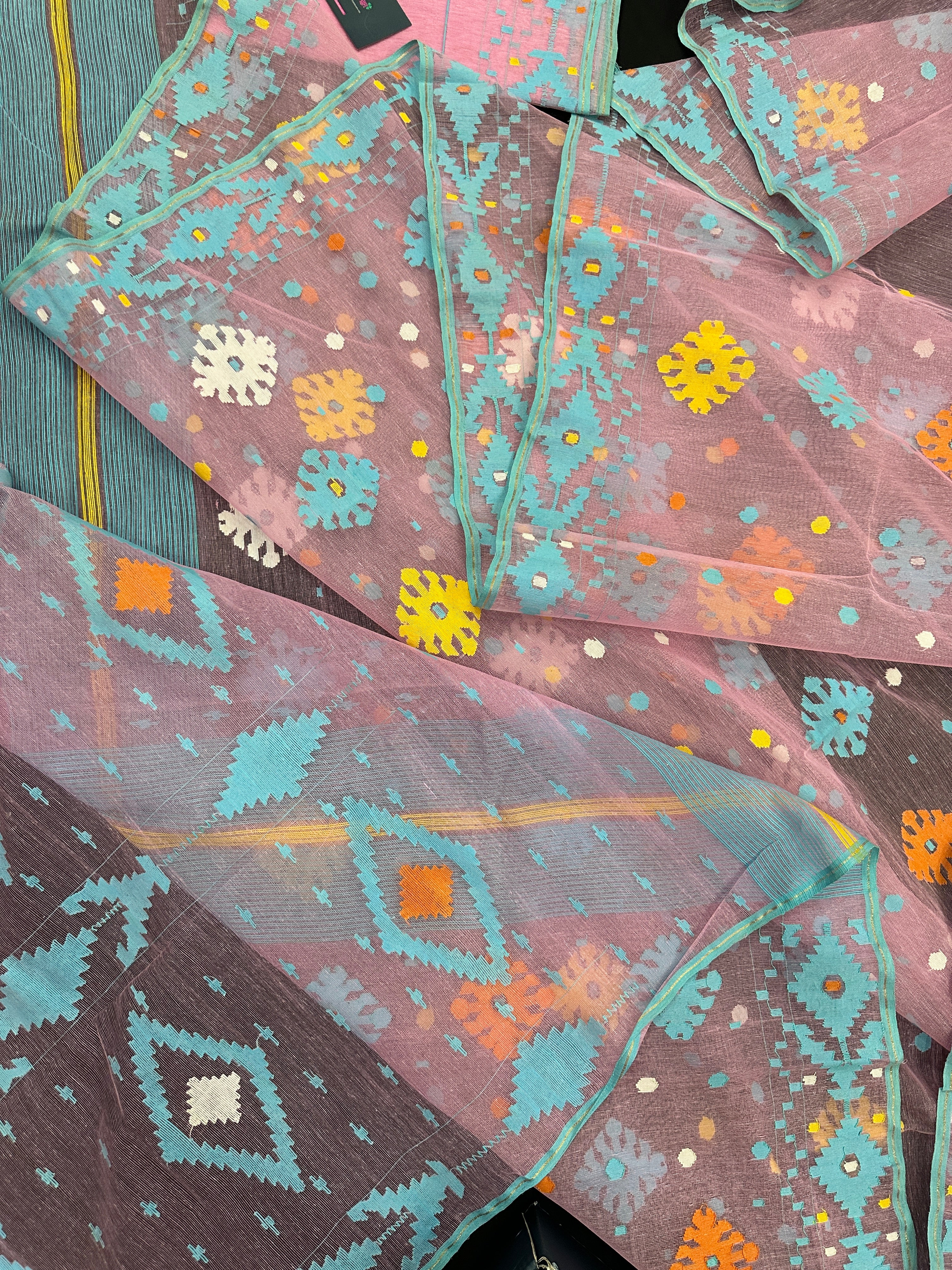 Pink jamdani saree with blue white yellow orange threads work and blouse piece.