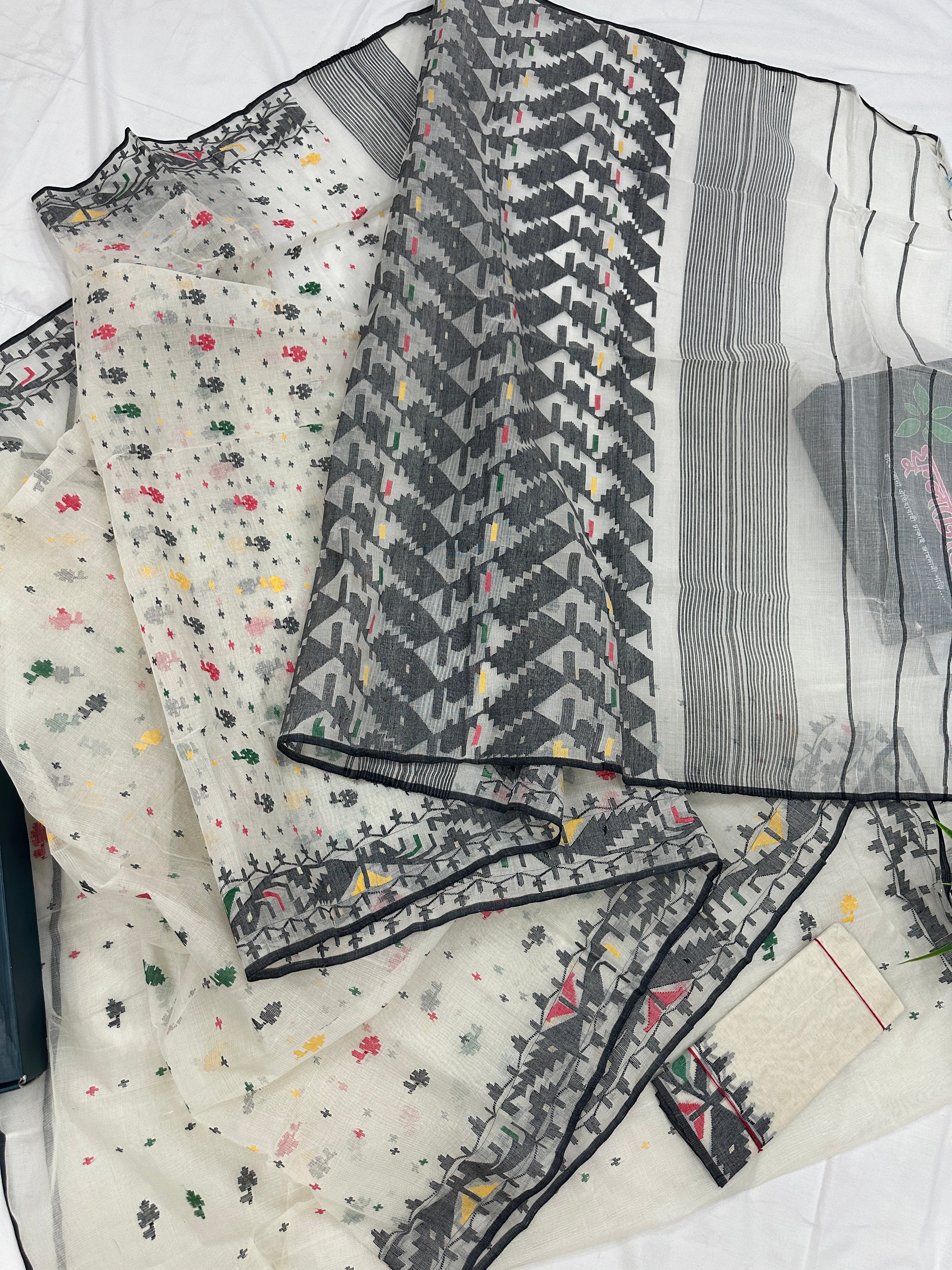 White cotton jamdani saree with black red yellow green threads work & blouse piece.