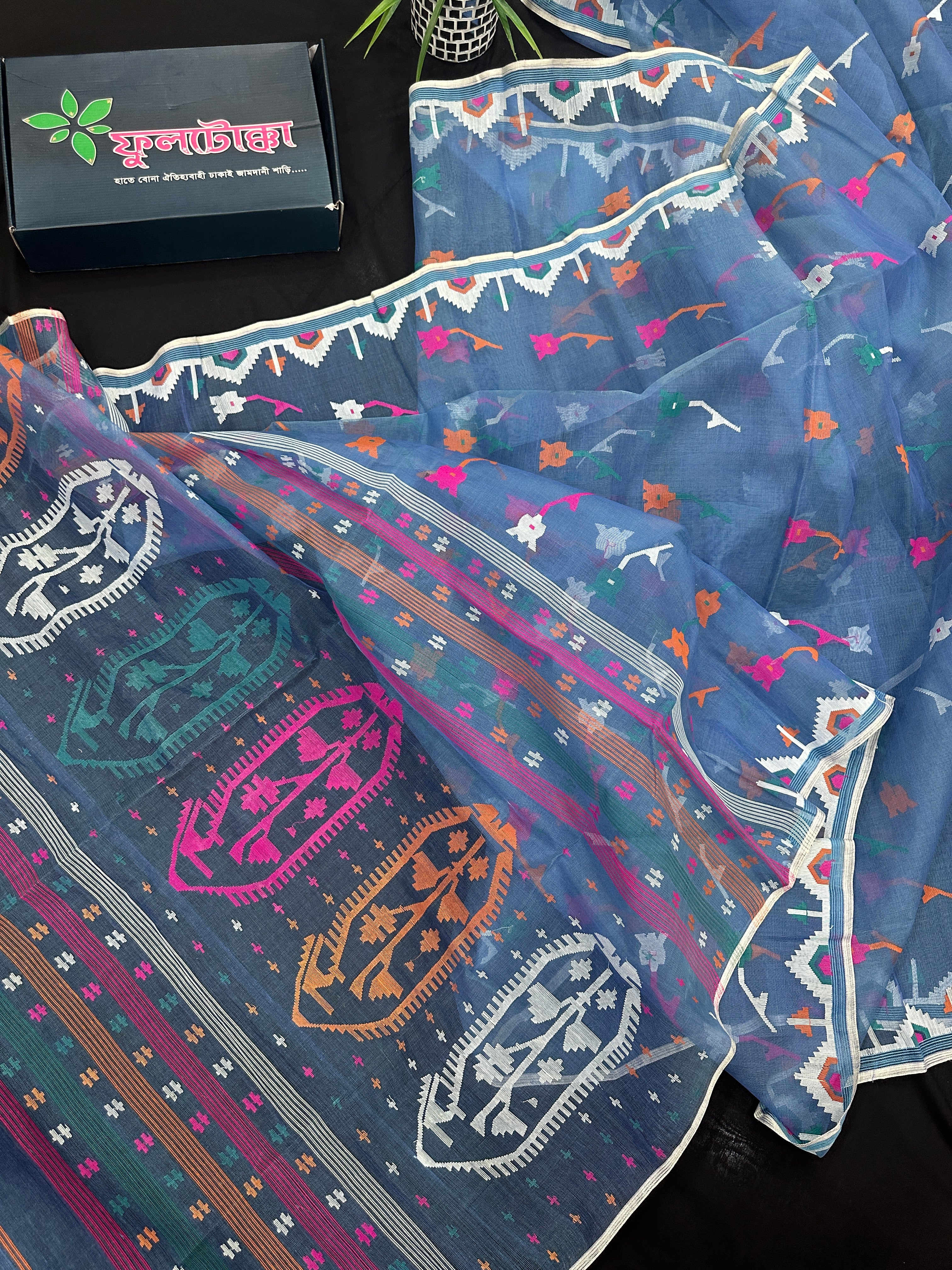 Dusty blue jamdani saree with pink white blue green work and white paar.