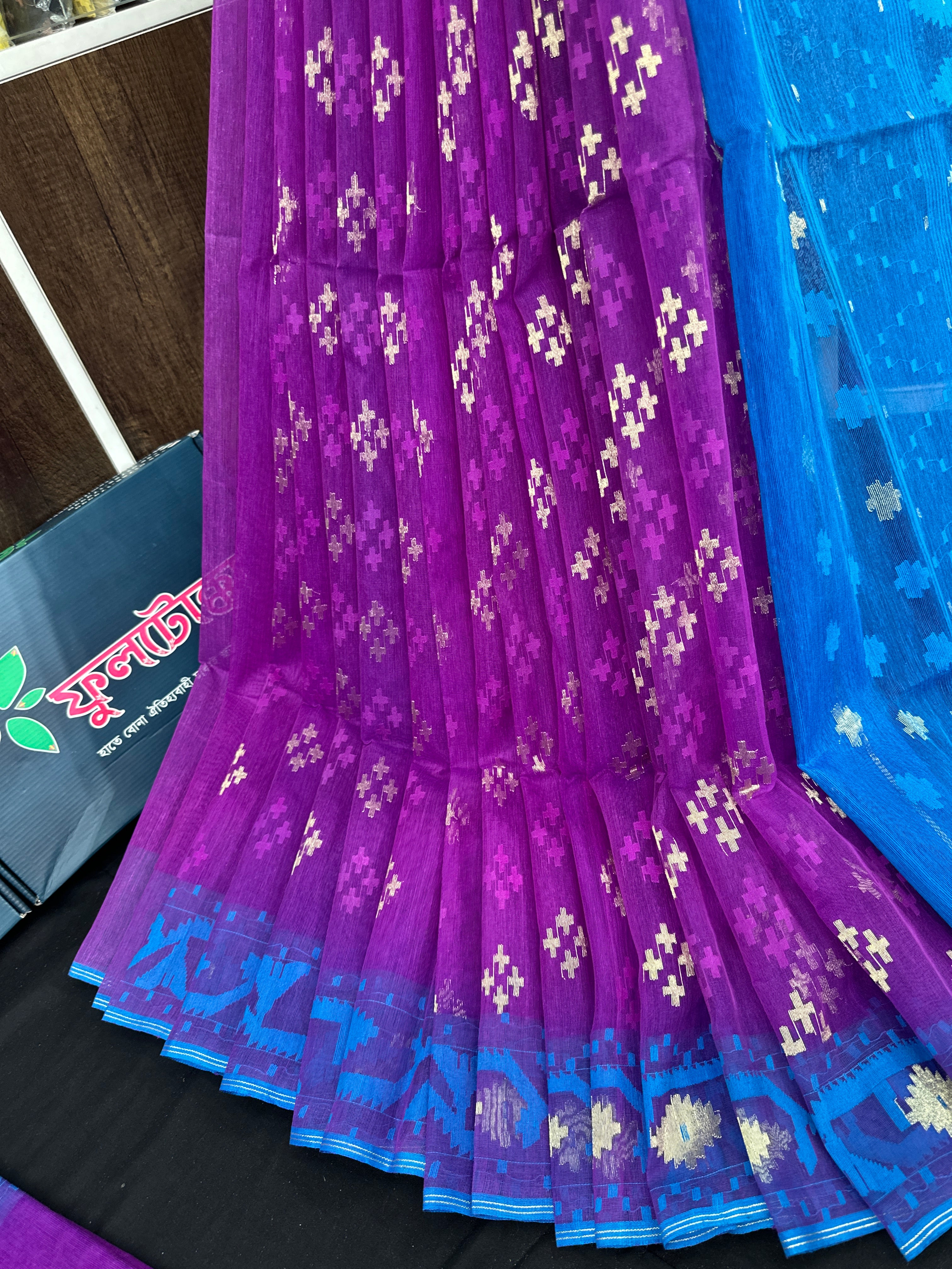 Purple halfsilk jamdani saree with golden jori work and contrast blue paar