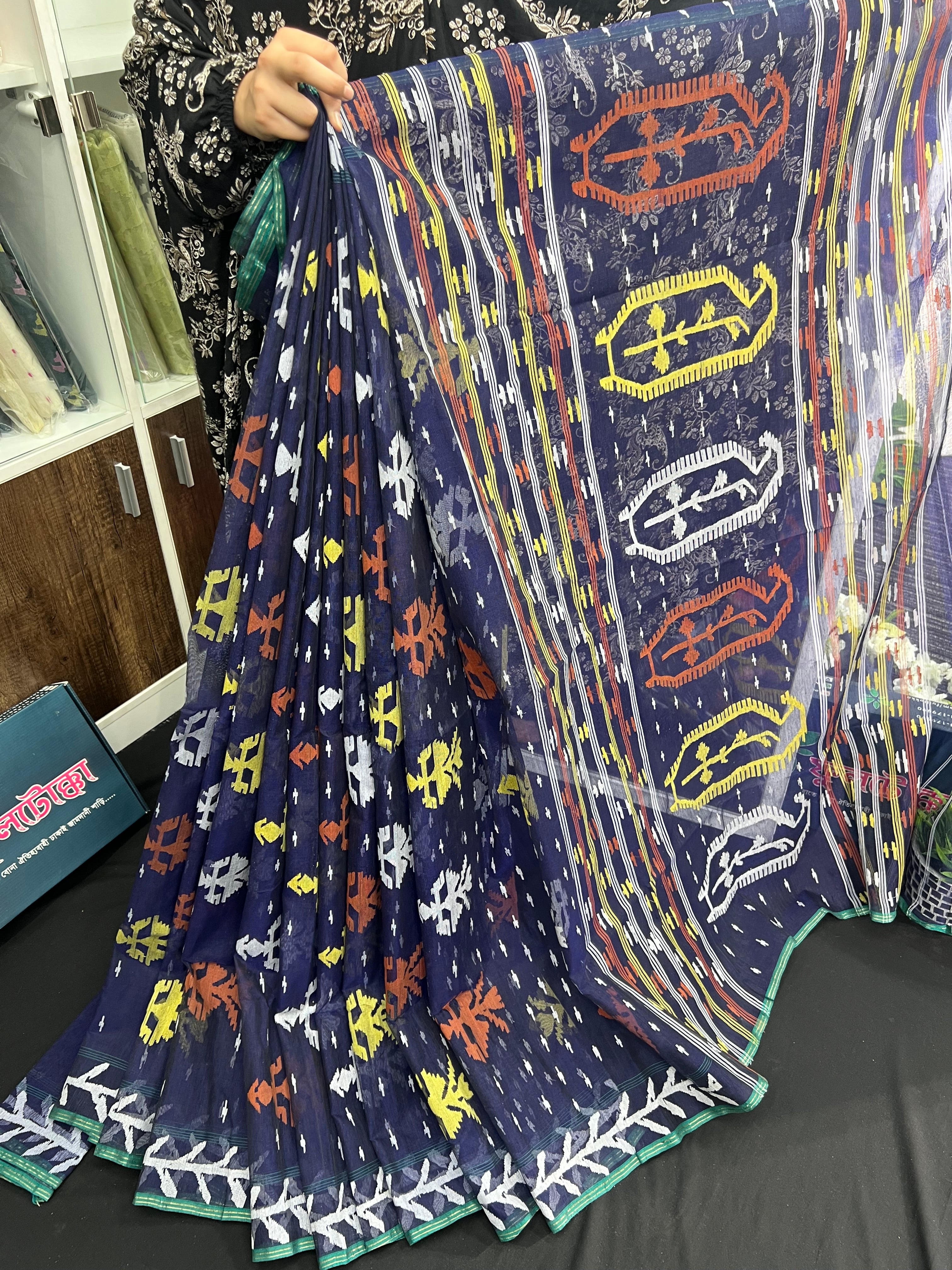 Deep blue halfsilk jamdani saree with orange yellow white threads work