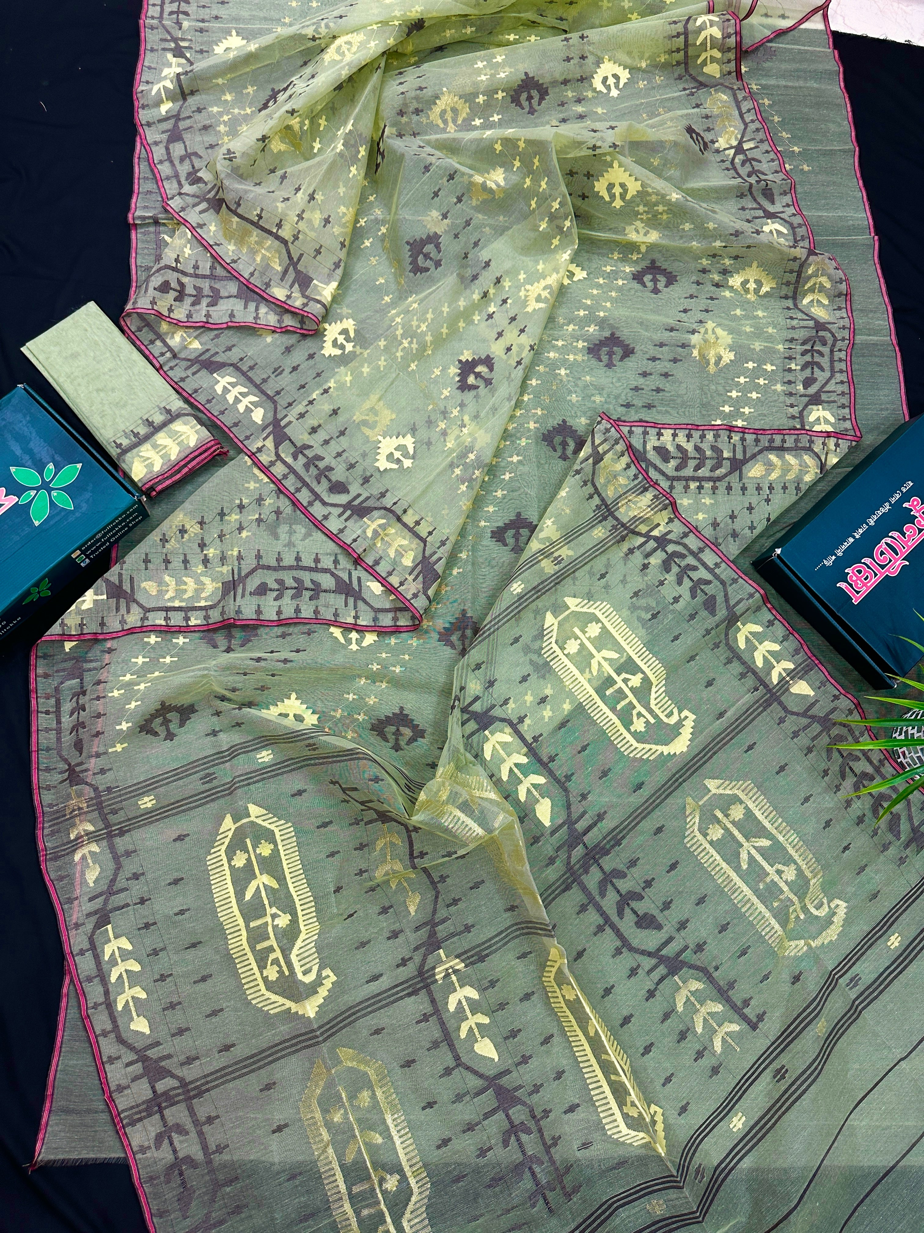 Pear green type Lite mint jamdani saree with threads work.