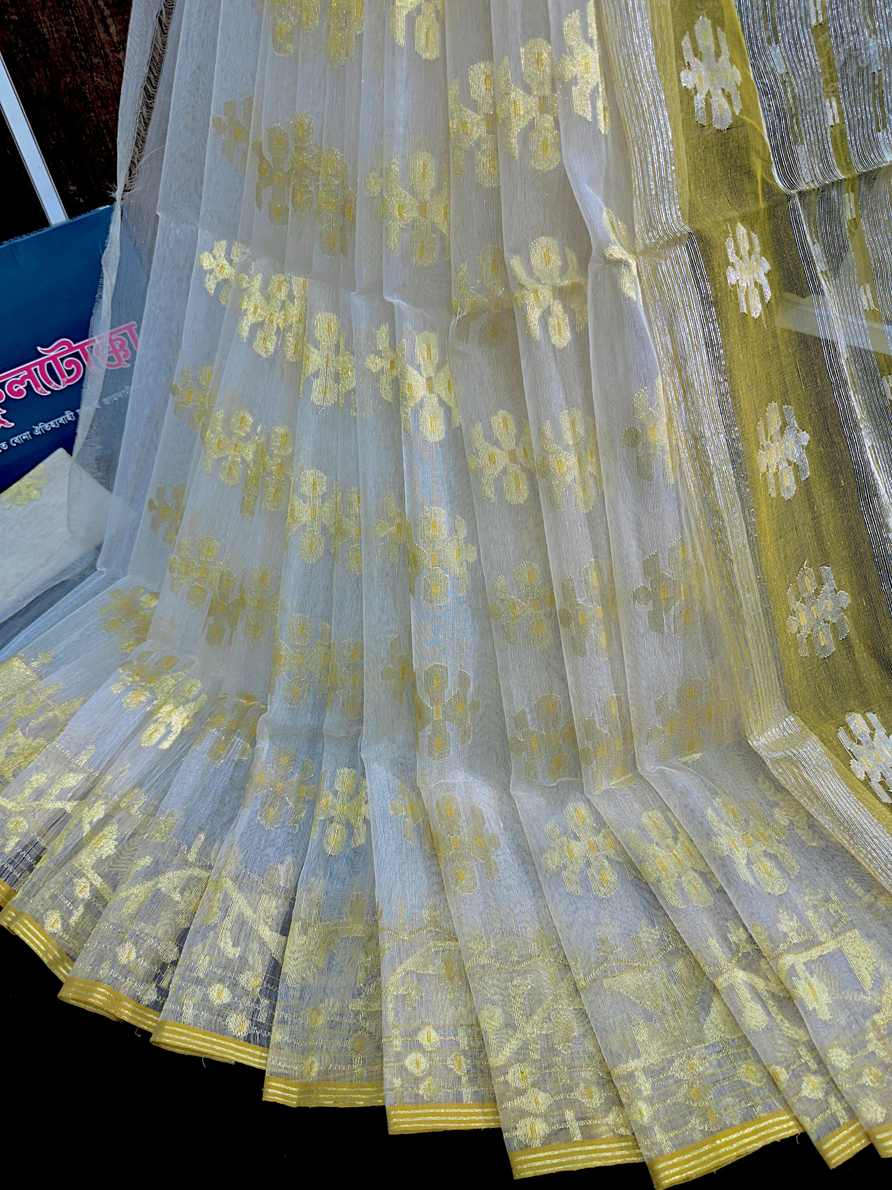 Creamy white halfsilk jamdani saree with golden jori work and blouse piece
