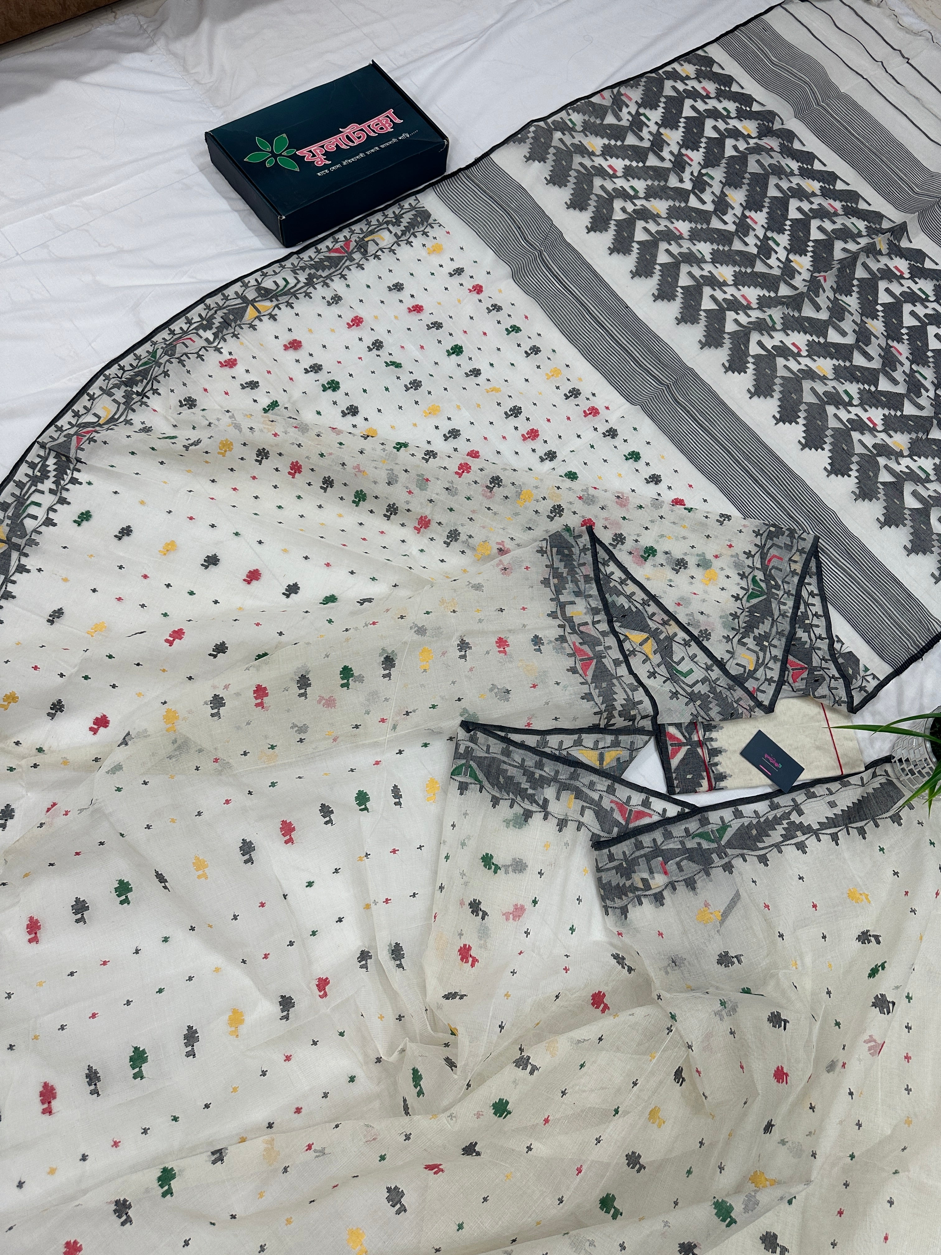 White cotton jamdani saree with black red yellow green threads work & blouse piece.