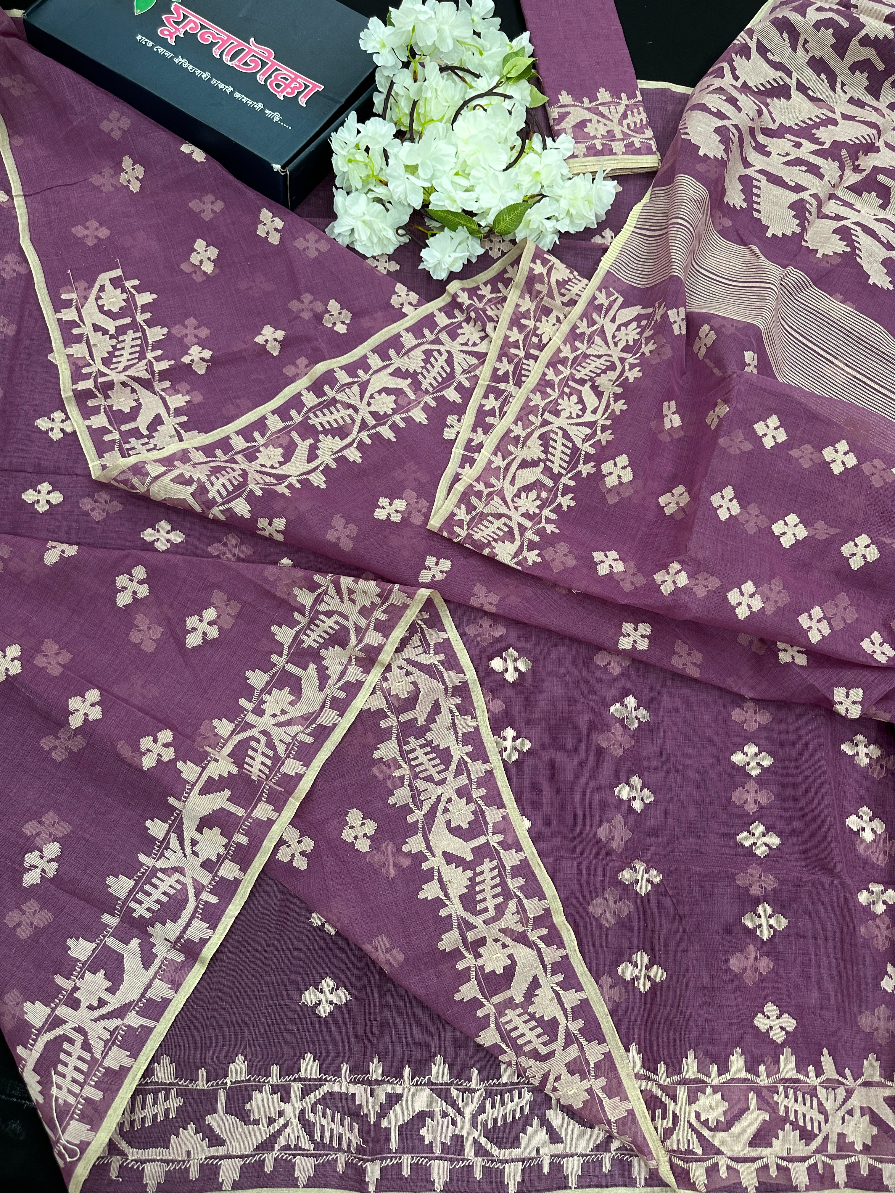 Onion cotton jamdani saree with yellowish threads work all over work.