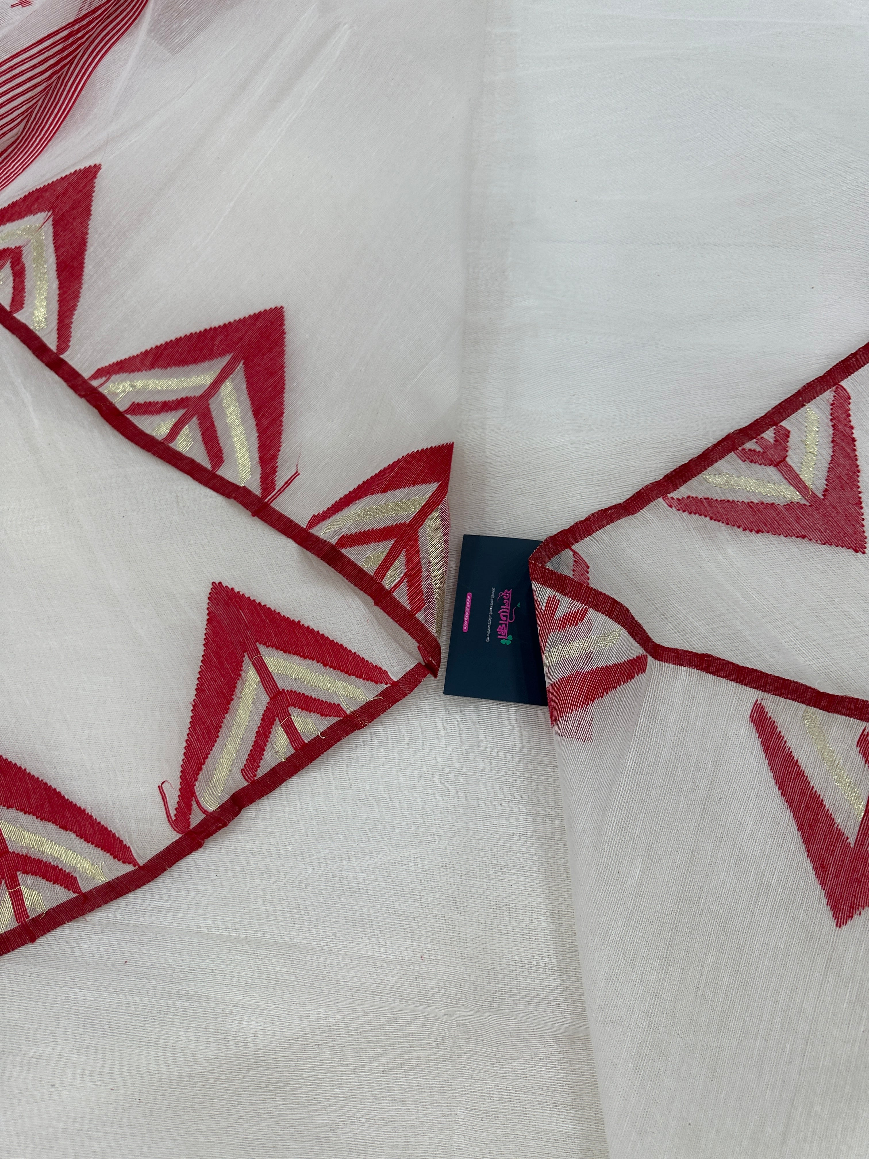White Jamdani Saree With Red Paar.
