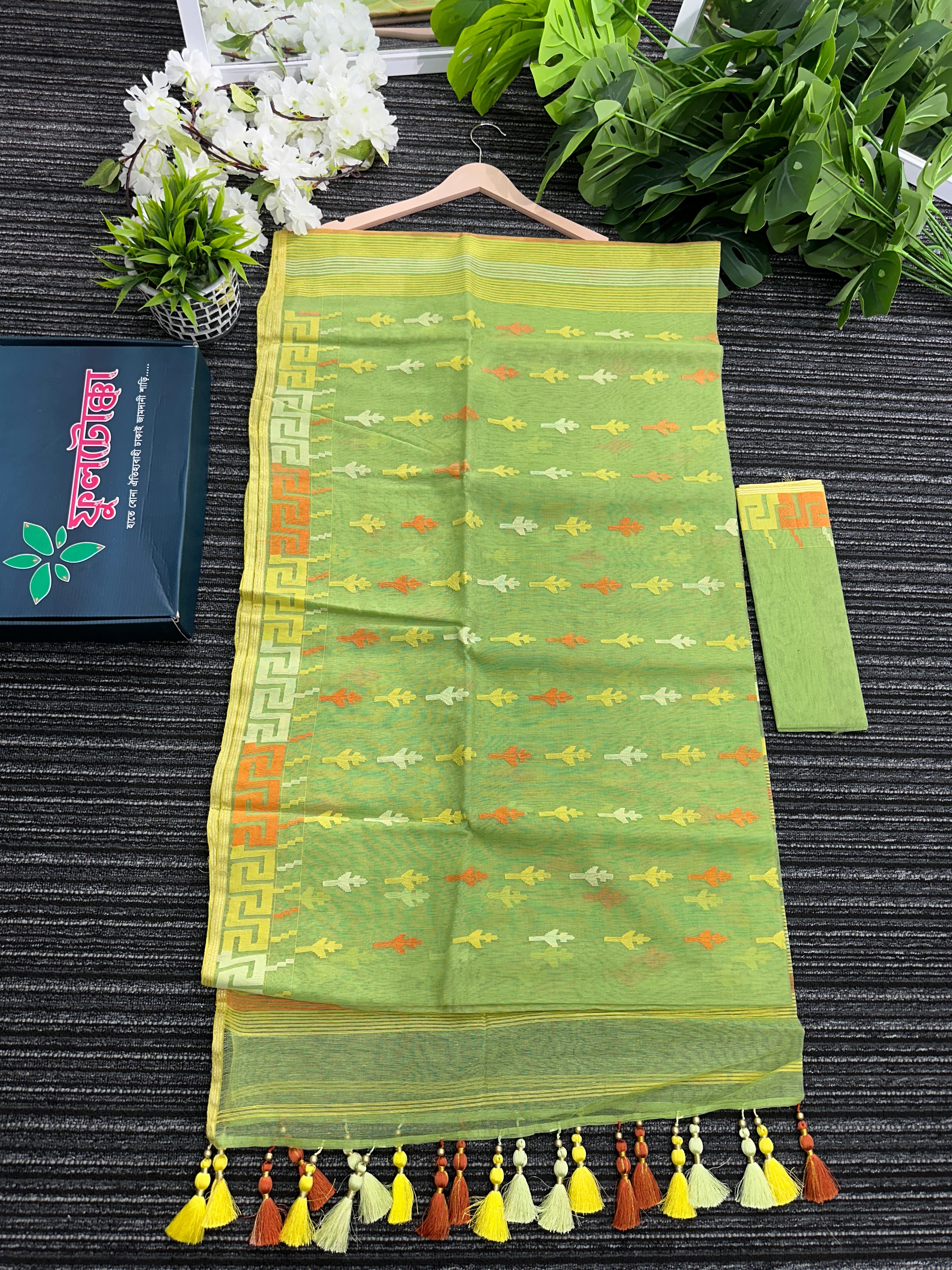 Olive green halfsilk jamdani saree with orange and olive threads work