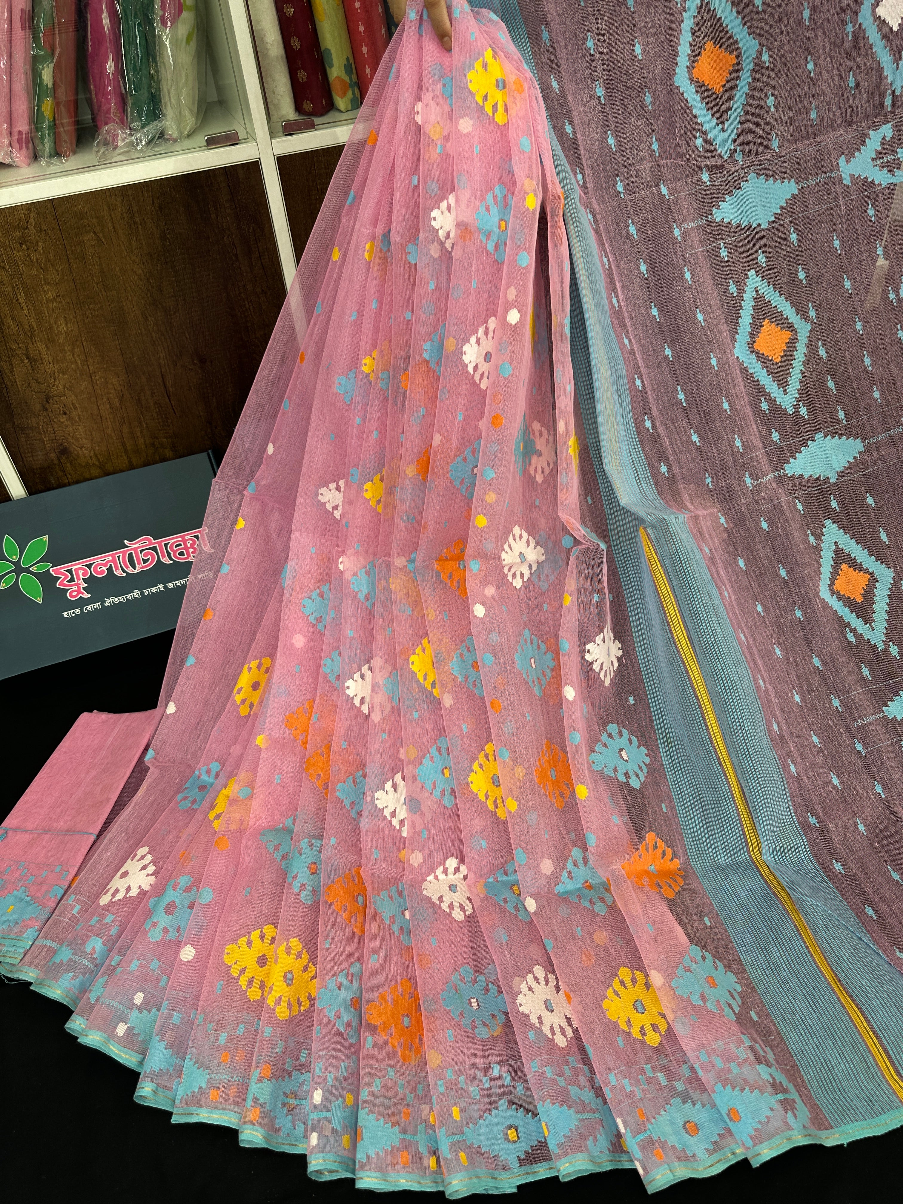 Pink jamdani saree with blue yellow white orange threads work