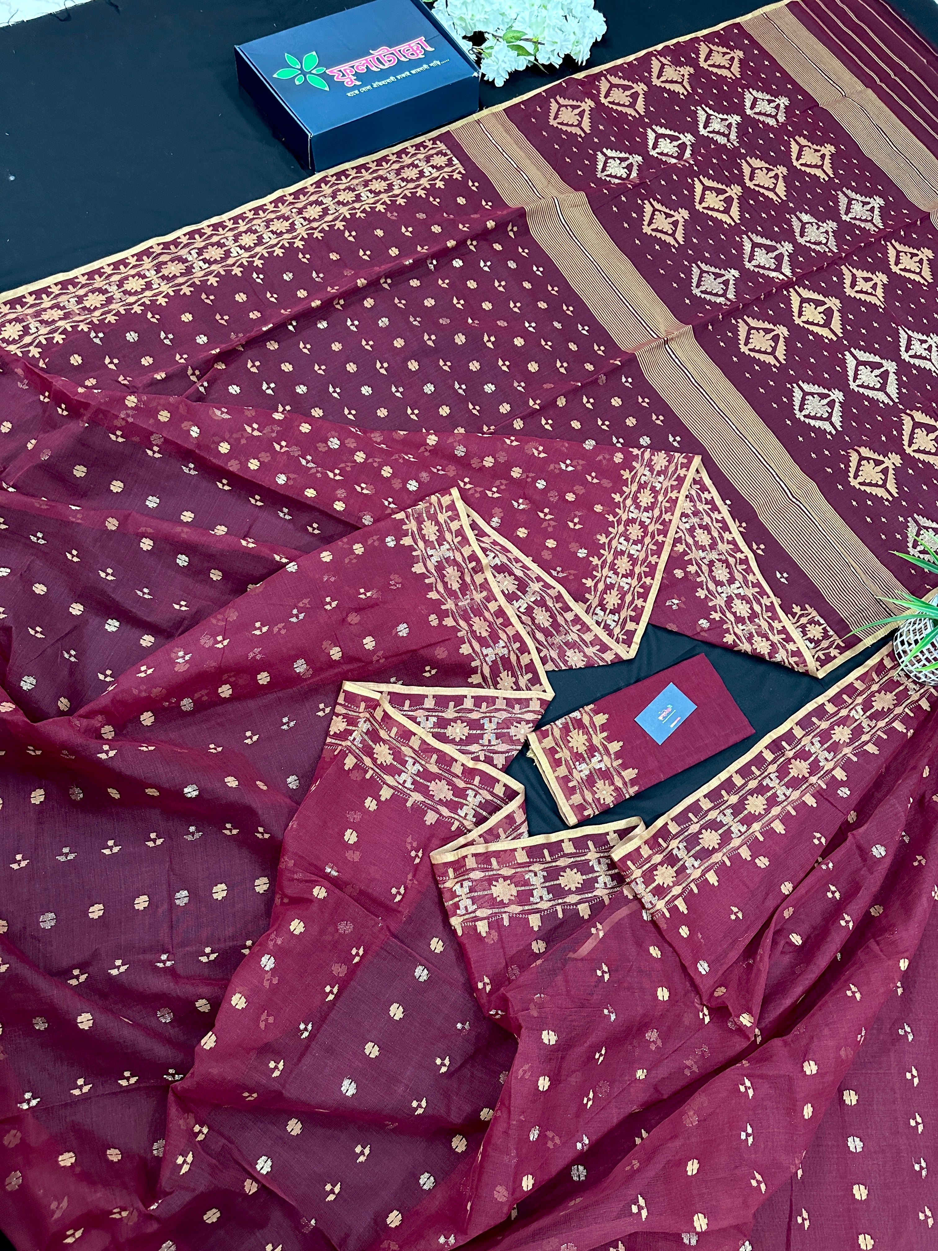 Maroon cotton jamdani with yellowish threads work.