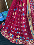 Maroon jamdani saree with golden jori work all over work with blouse piece.