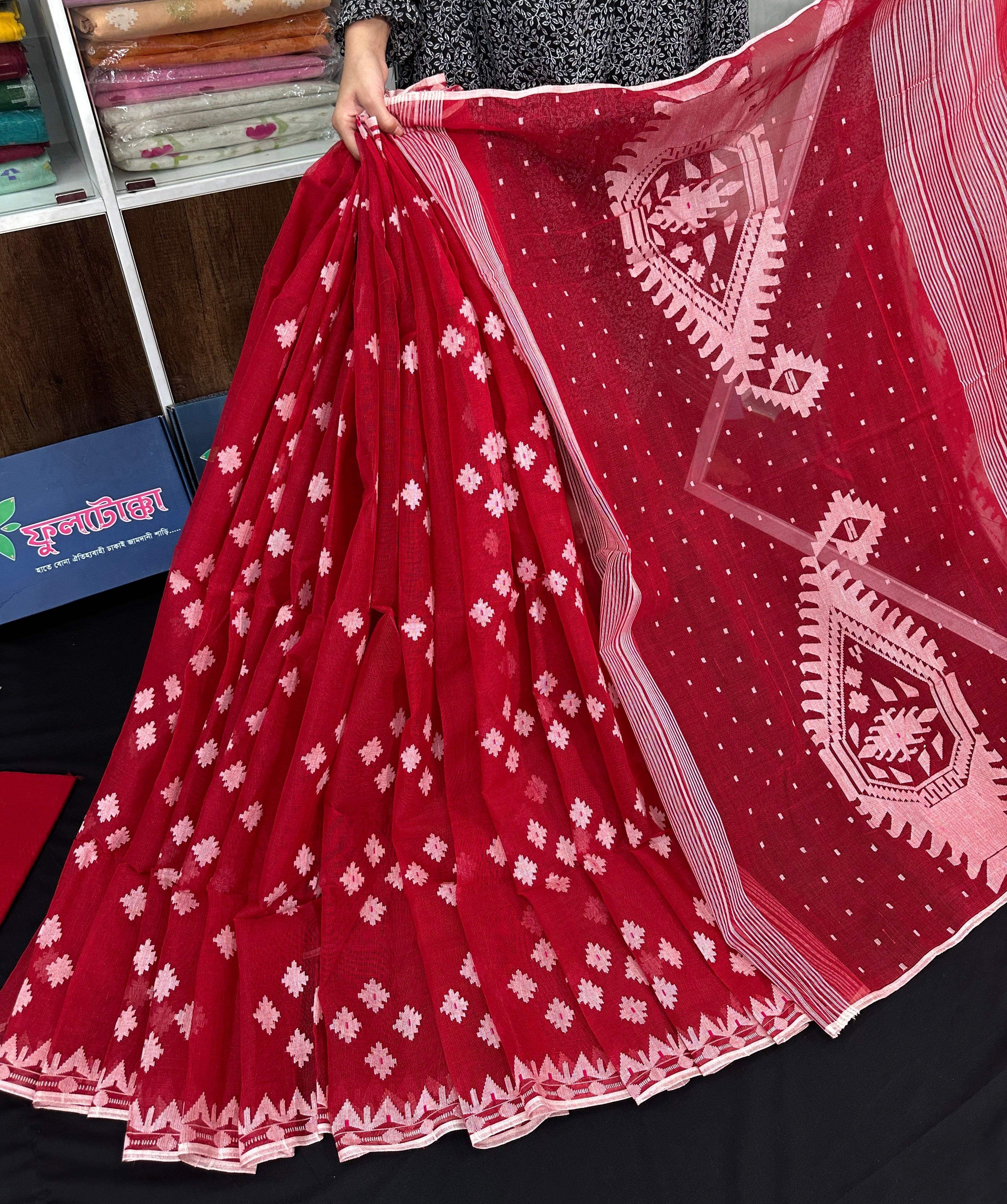 Radish Maroon cotton jamdani saree with white threads work all over work.