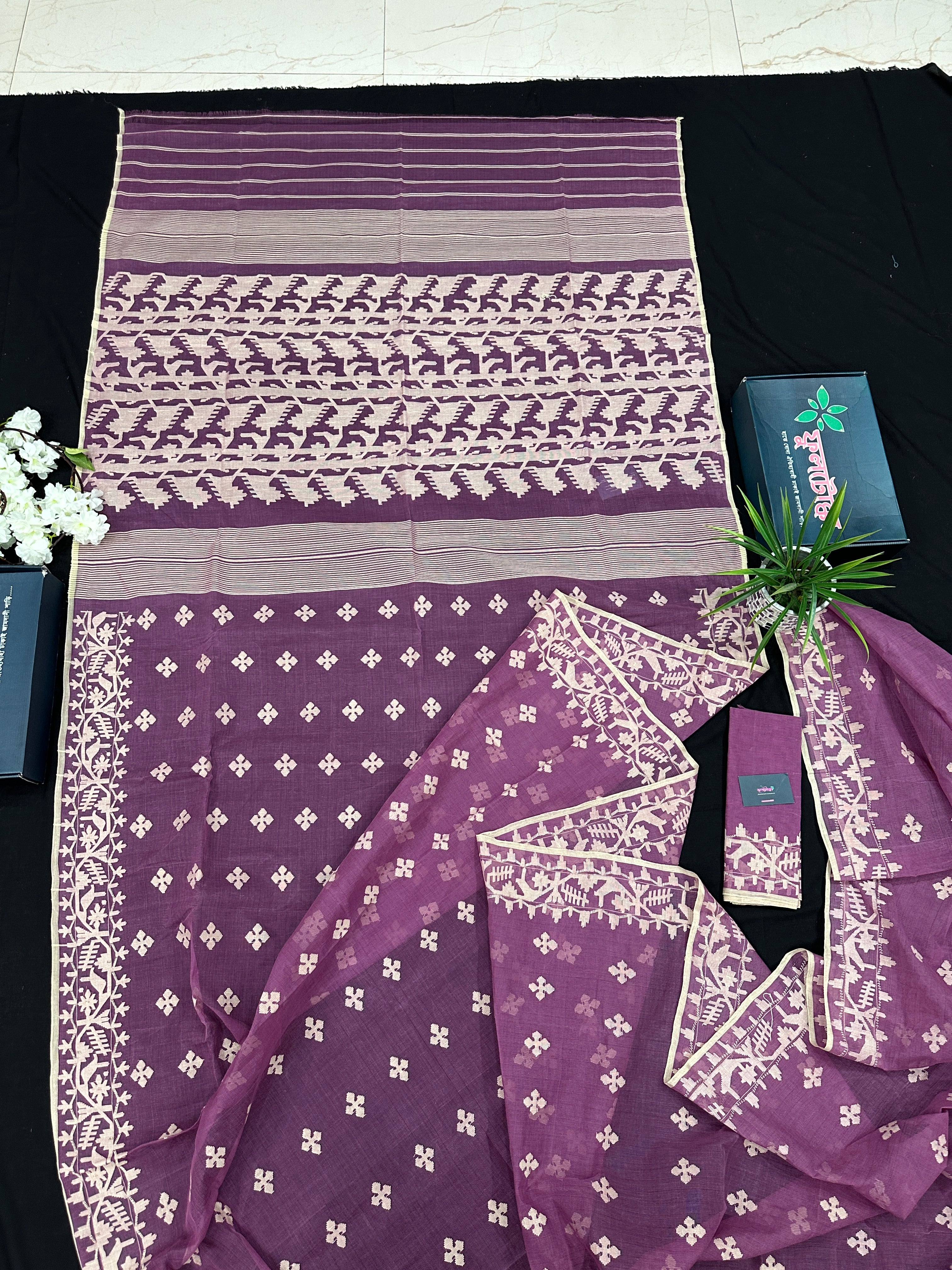 Onion cotton jamdani saree with yellowish threads work all over work.
