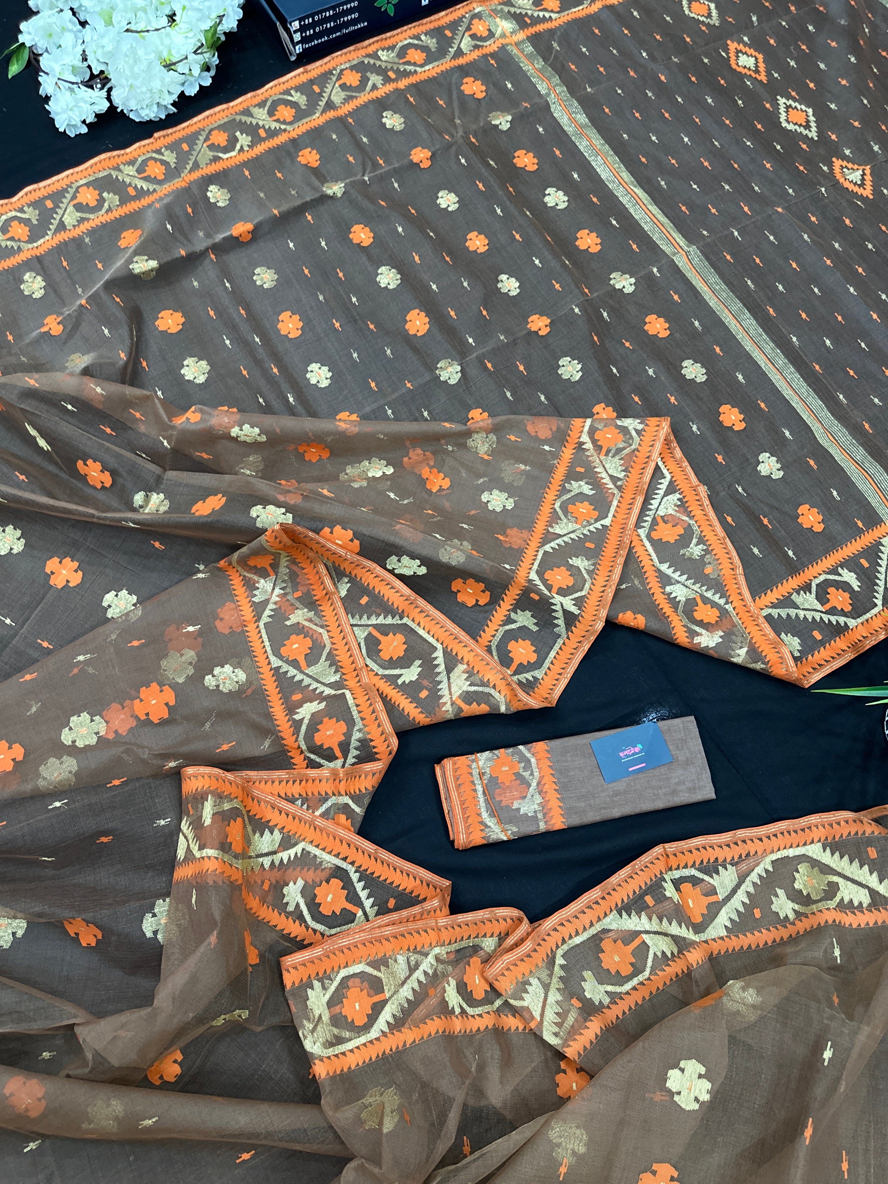 Peanut Brown dhakai jamdani saree with orange threads work & golden jori work all over soft count.
