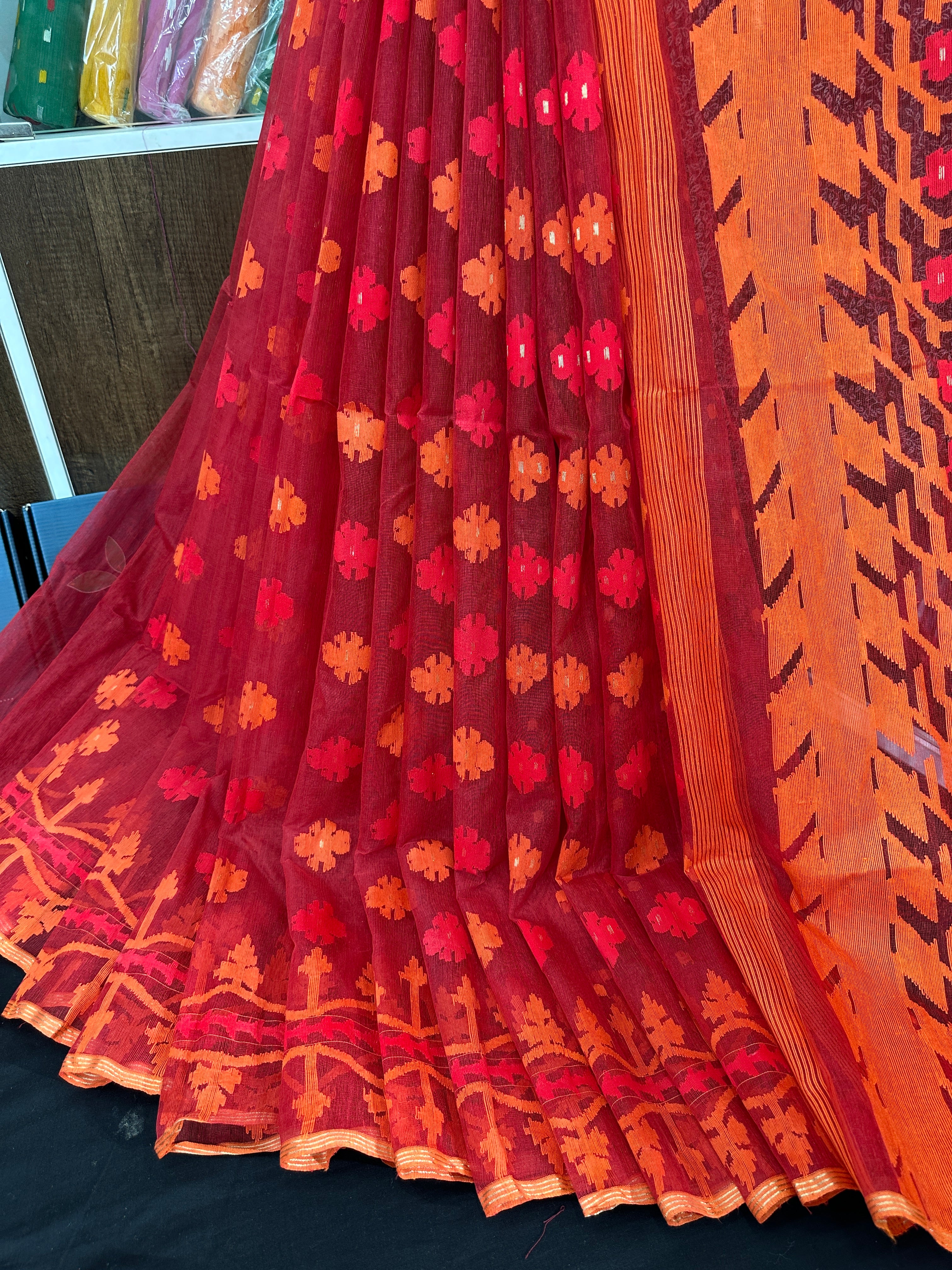 Maroon red jamdani saree with orange and red threads work