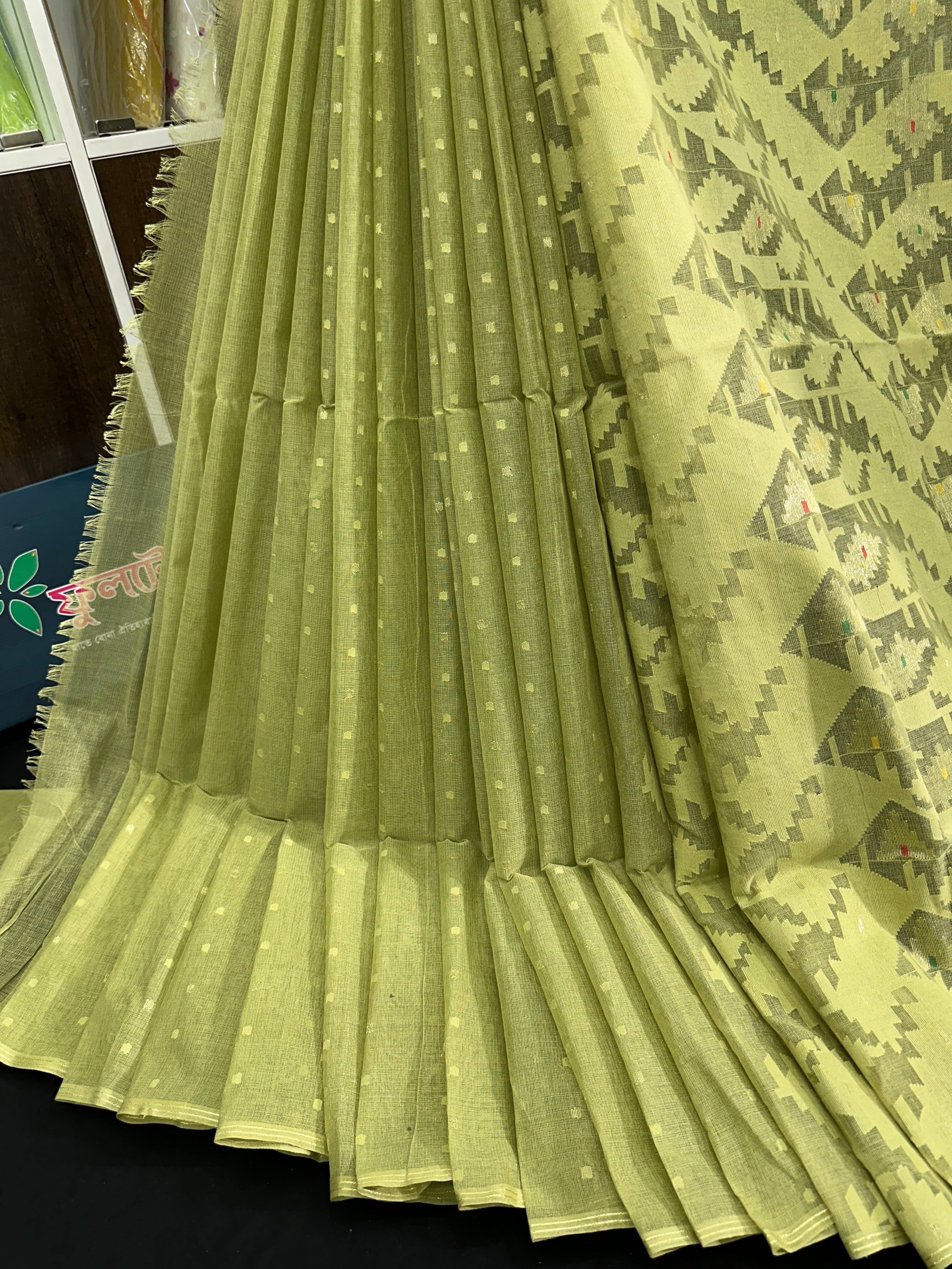 Olive jamdani saree with white threads work and self threads work
