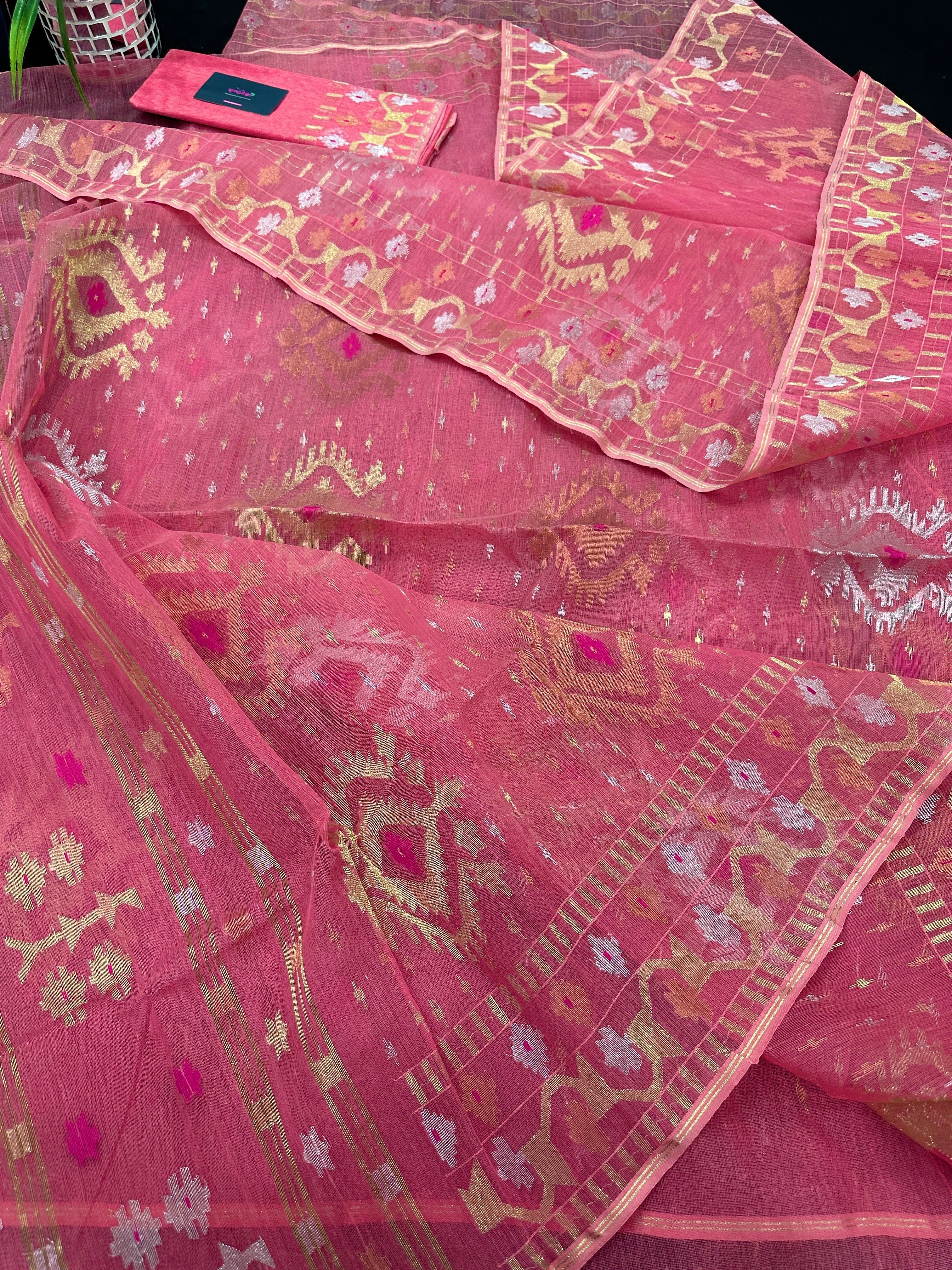 Peach pink jamdani saree with golden silver & copper jori work.