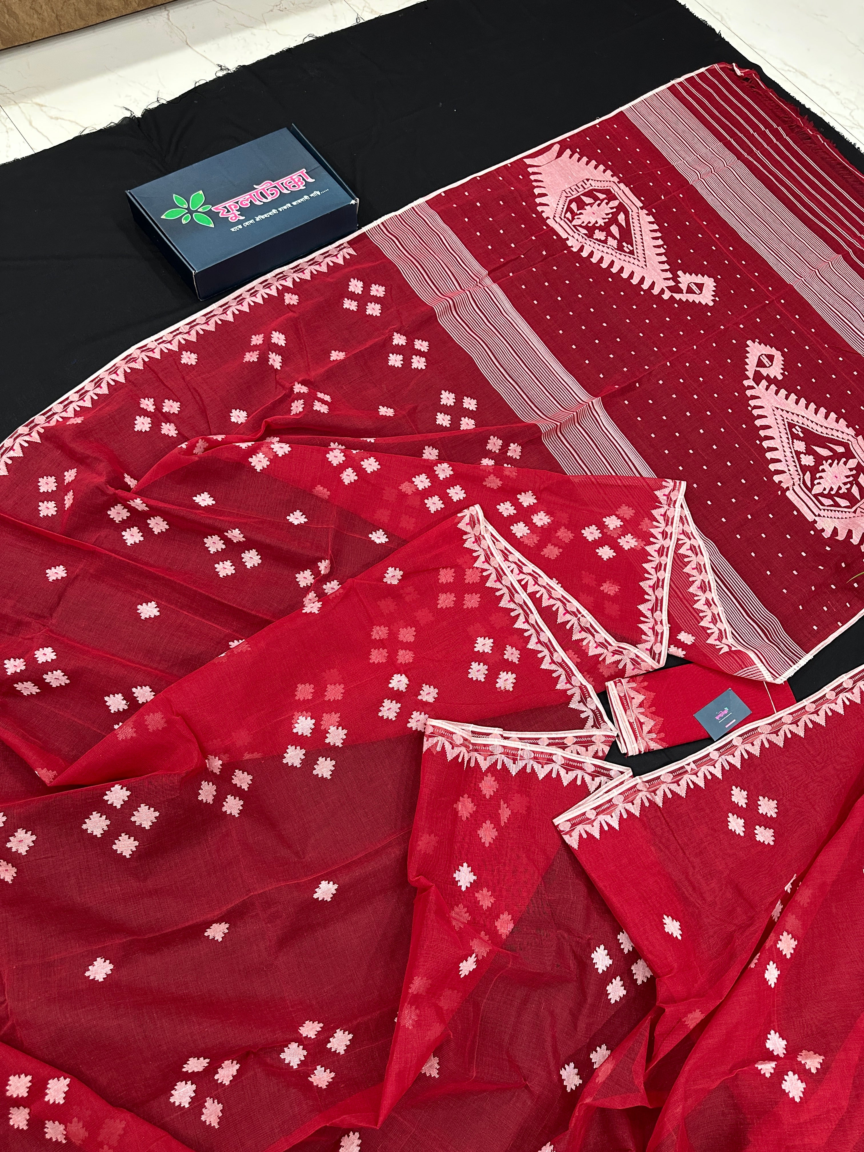 Radish Maroon cotton jamdani saree with white threads work all over work.