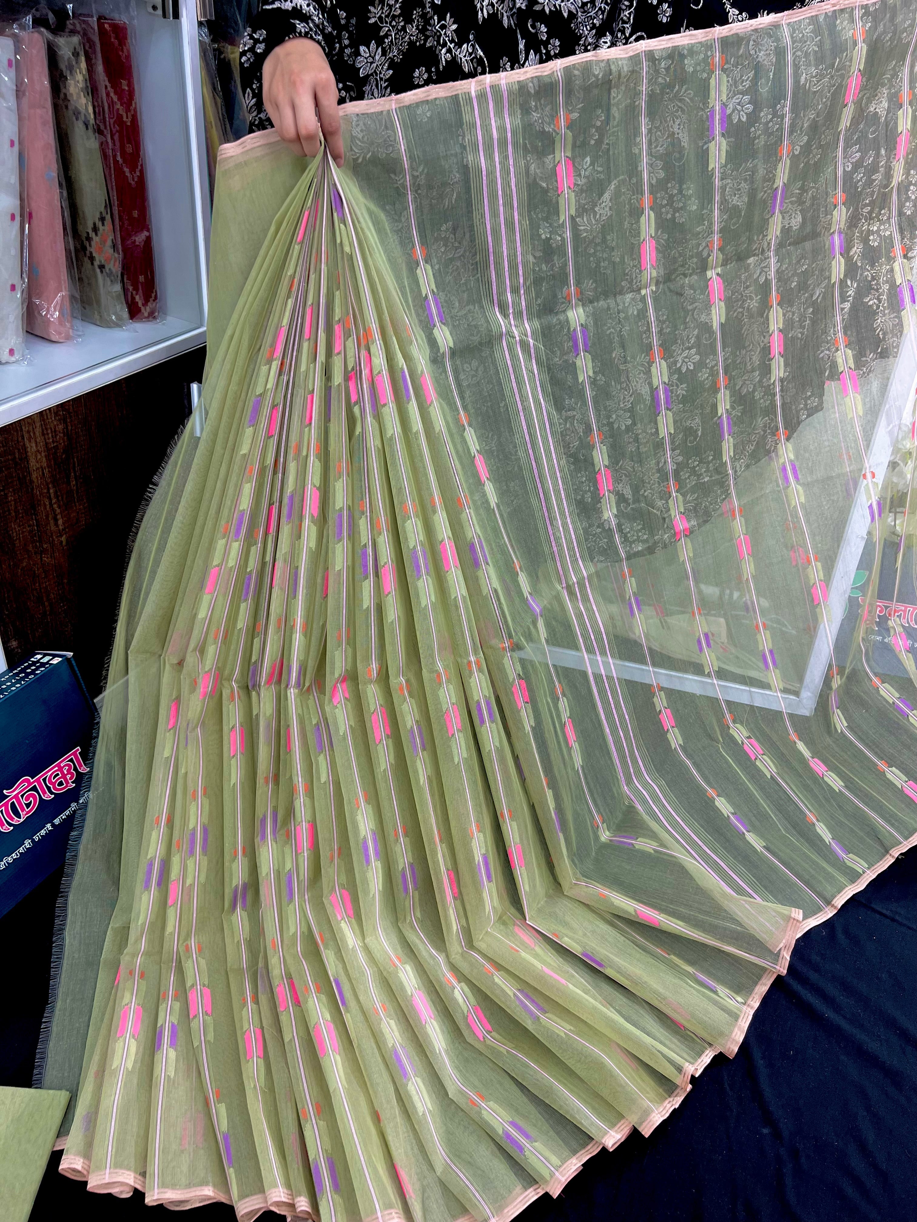 Lite olive halfsilk jamdani saree with pink blue olive threads work