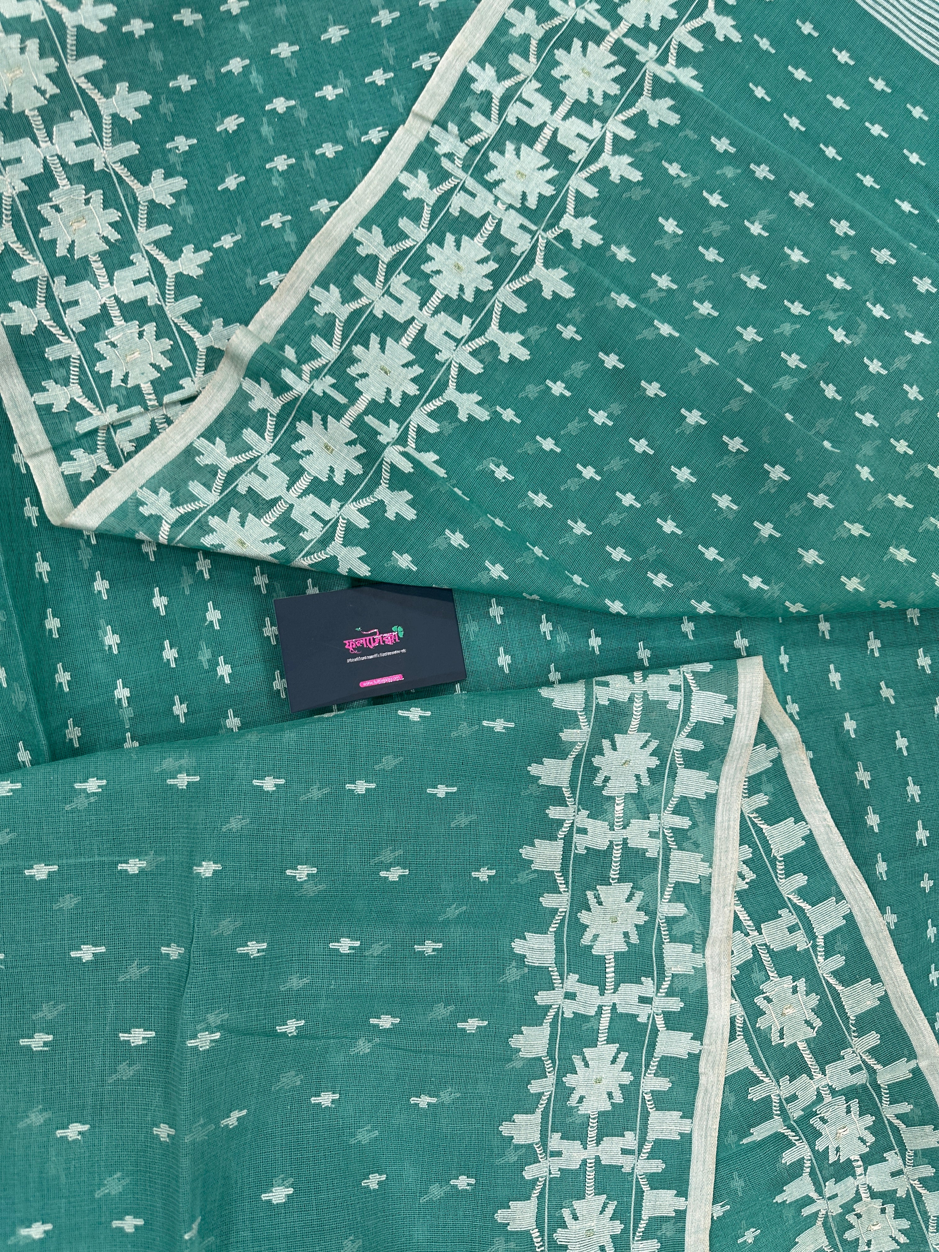 Mint cotton jamdani saree with white threads work all over work and blouse piece.